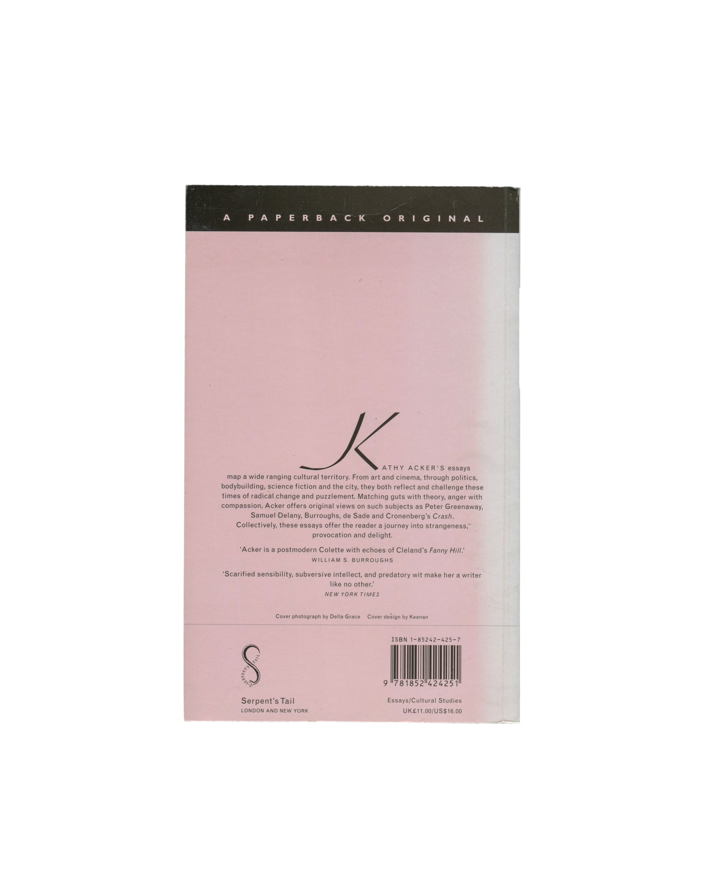 The back cover of a Kathy Acker book, featuring a pale pink background with a black top band reading 'A PAPERBACK ORIGINAL' and a large stylized 'K' logo, photographed on a white background.
