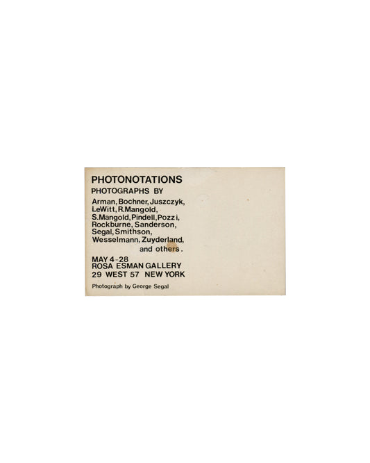 Verso — artist roster Photonotations, Rosa Esman Gallery, New York, 1976. Exhibition invitation verso: cream-white card; "PHOTONOTATIONS" in large bold black sans-serif type upper left; "PHOTOGRAPHS BY" in smaller bold black sans-serif type below; artist roster in regular black sans-serif type — "Arman, Bochner, Juszczyk, / LeWitt, R.Mangold, / S.Mangold, Pindell, Pozzi, / Rockburne, Sanderson, / Segal, Smithson, / Wesselmann, Zuyderland, / and others."; "MAY 4–28" in bold below; "ROSA ESMAN GALLERY / 29 WE