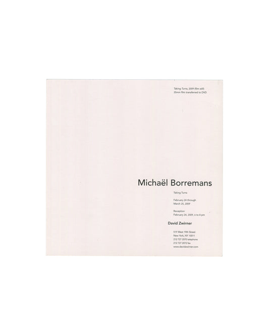 Front of 2009 Michaël Borremans Taking Turns David Zwirner exhibition invitation card showing a near-square colour film still from Taking Turns (2009), 35mm film transferred to DVD: two figures seen from behind in close proximity, both with short blonde hair, wearing dark clothing, their heads slightly turned toward each other against a very dark, almost black background; the image is soft-focus and atmospherically lit, creating a sense of psychological tension, doubling, and uneasy intimacy.