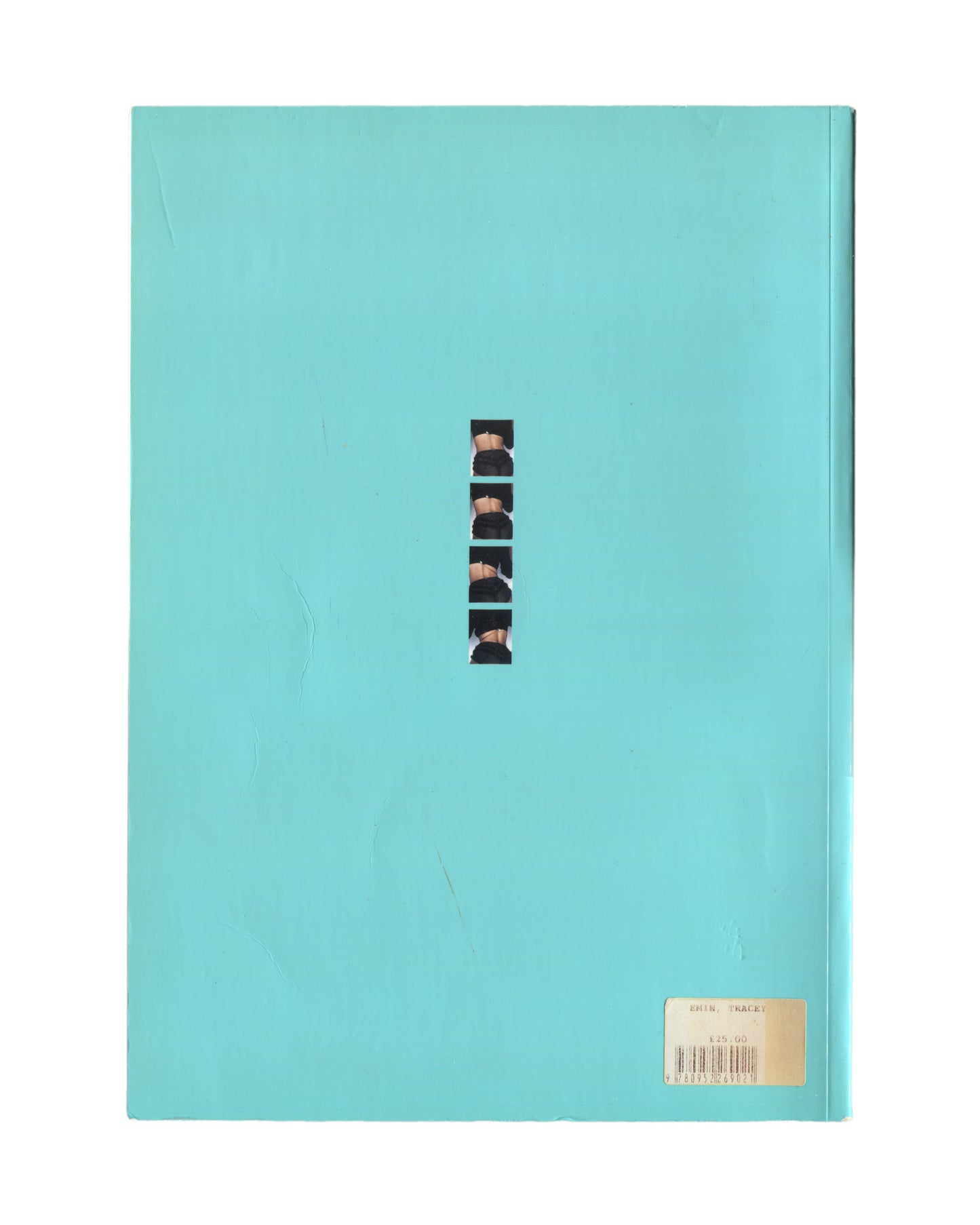 Tracey Emin — I Need Art Like I Need God, Jay Jopling/London, 1998. Back cover. Solid turquoise glossy ground. Centre: narrow vertical strip of five black-and-white photographic fragments of the artist's body, sequenced like a contact sheet. Original price/barcode sticker lower right: £25.00, Emin / Tracey. Exhibition monograph, South London Gallery 1997.
