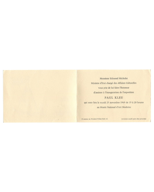 Paul Klee, exhibition invitation card verso. Musée National d'Art Moderne, Paris, 1969. Plain cream card, no text or image. Faint embossed or impressed text visible along the top edge, partially legible, consistent with a printed address or gallery name pressed through from the interior. Light age toning, minor surface marks, and faint handling wear.