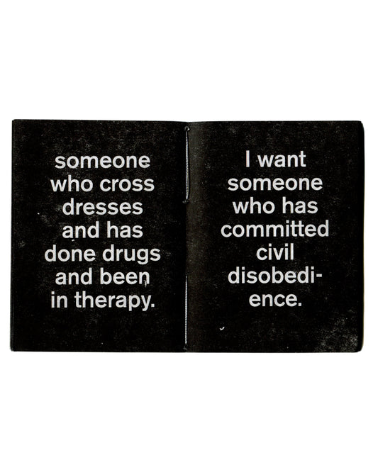 Interior spread of Zoe Leonard, I Want a President, Gato Negro, 2017, showing white sans-serif text on black pages reading "someone who cross dresses and has done drugs and been in therapy." on the left and "I want someone who has committed civil disobedience." on the right, with visible hand-sewn binding at centre.