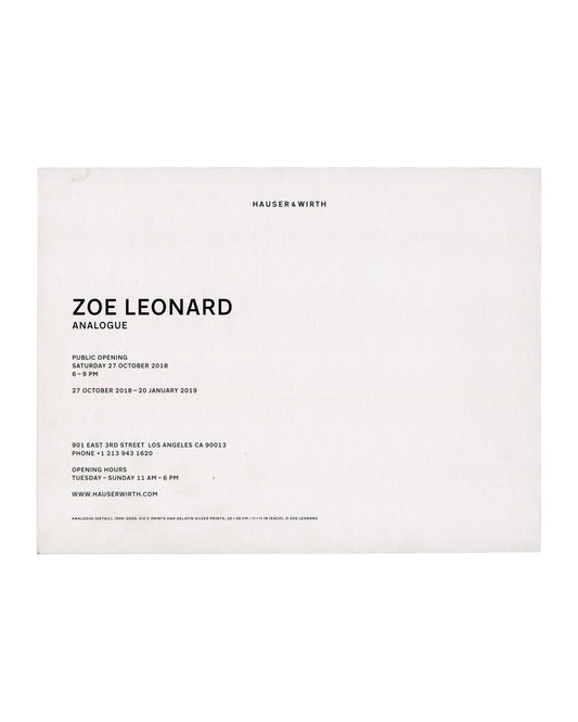 Verso Zoe Leonard, Analogue, Hauser & Wirth Los Angeles, 2018. Invitation verso: white card; 'ZOE LEONARD / ANALOGUE' in bold sans-serif; public opening Saturday 27 October 2018, 6–9 PM; '27 October 2018–20 January 2019'; 901 East 3rd Street Los Angeles; 'WWW.HAUSERWIRTH.COM'; work caption at foot — 'ANALOGUE (DETAIL), 1998–2009, 412 C-PRINTS AND GELATIN SILVER PRINTS, 28 × 28 CM © ZOE LEONARD'.