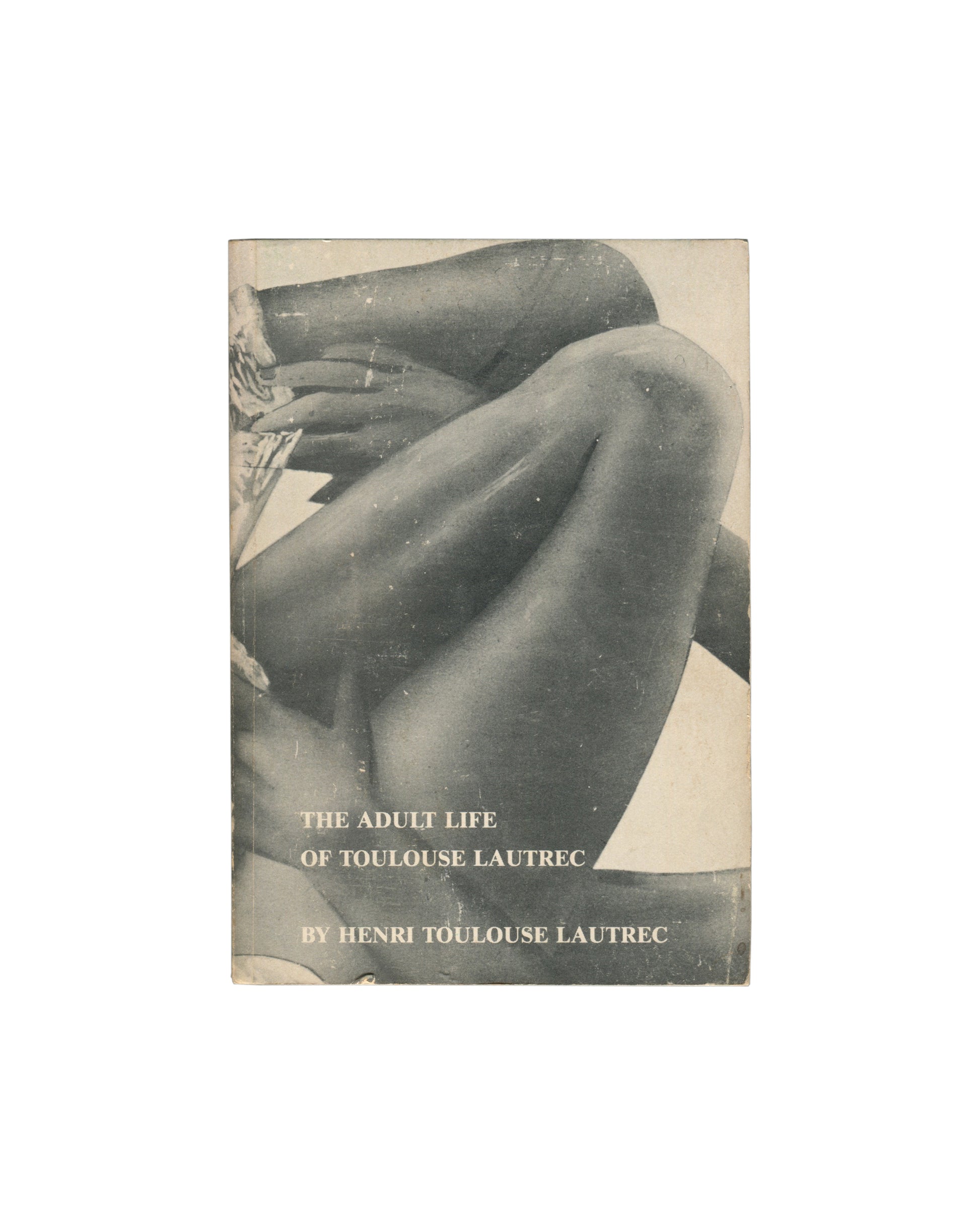 Original 1978 Kathy Acker The Adult Life of Toulouse Lautrec by Henri Toulouse Lautrec paperback, TVRT Press and Printed Matter, New York. Front cover with black-and-white photographic image of two pairs of legs, one in stockings raised in the air, the other bare and low. Title in lowercase serif type: all she wants is love... Publisher imprints PM and TVRT Press at foot with ISBN 0-931106-21-4. Original price $4.50 at top left. Covers with age toning and surface wear.