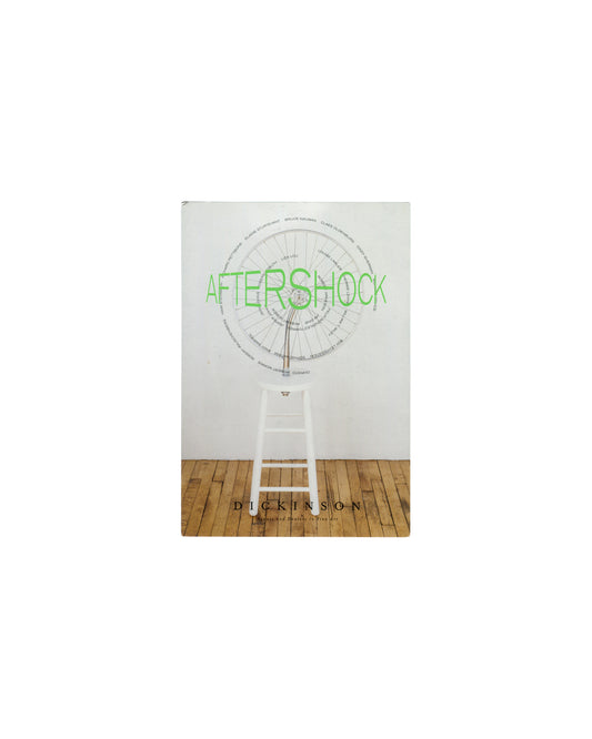 Aftershock, Dickinson Roundell 2003, front cover, white ground, green AFTERSHOCK title, bicycle wheel on white stool, Dickinson 