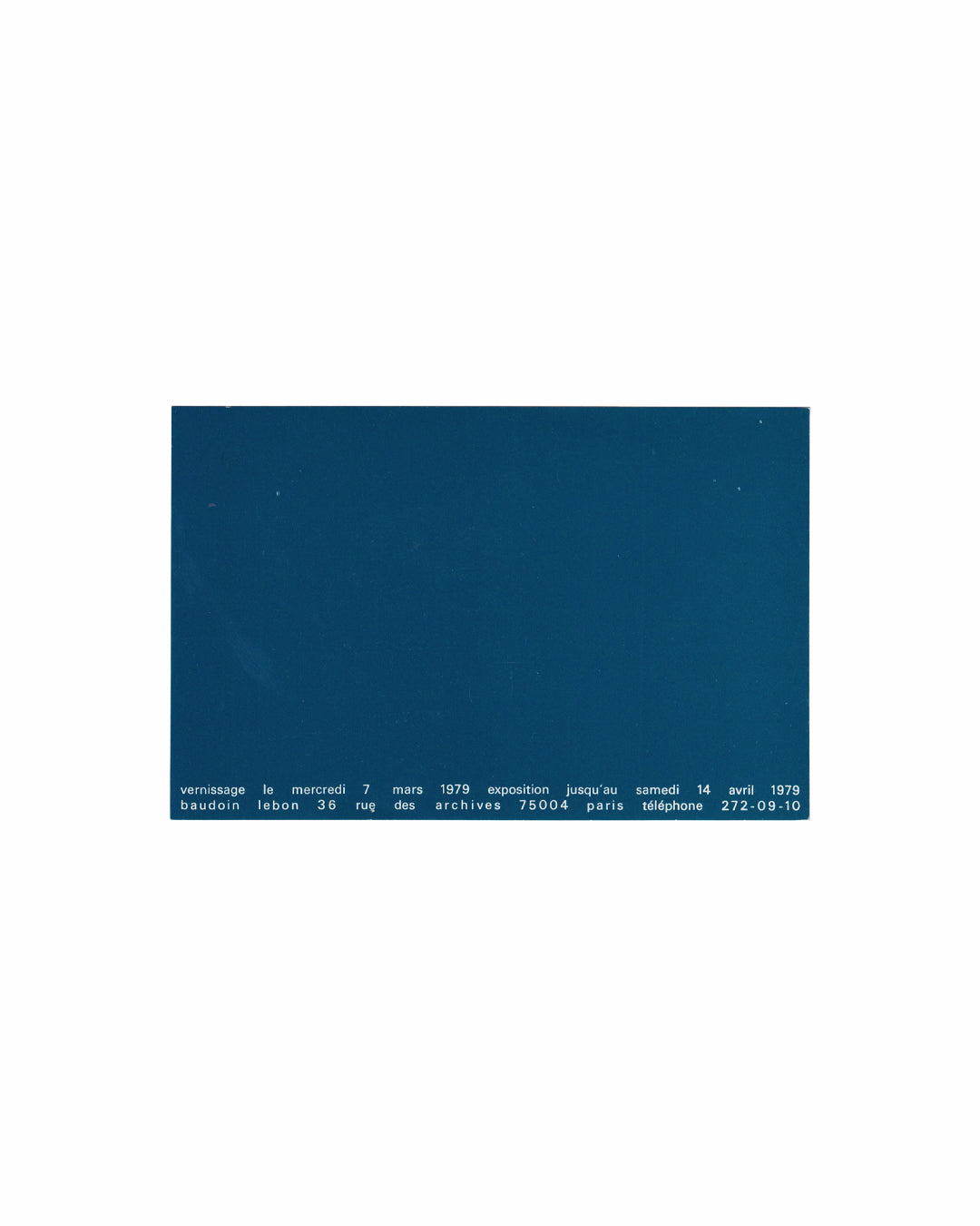 Reverse of 1979 Annie Gramain exhibition invitation, Galerie Baudoin Lebon, Paris. Verso showing plain deep teal card stock with two lines of white spaced sans-serif type at the lower edge: 'vernissage le mercredi 7 mars 1979 exposition jusqu'au samedi 14 avril 1979 / baudoin lebon 36 rue des archives 75004 paris téléphone 272-09-10'. The upper field is entirely unprinted. 14 × 9 cm.