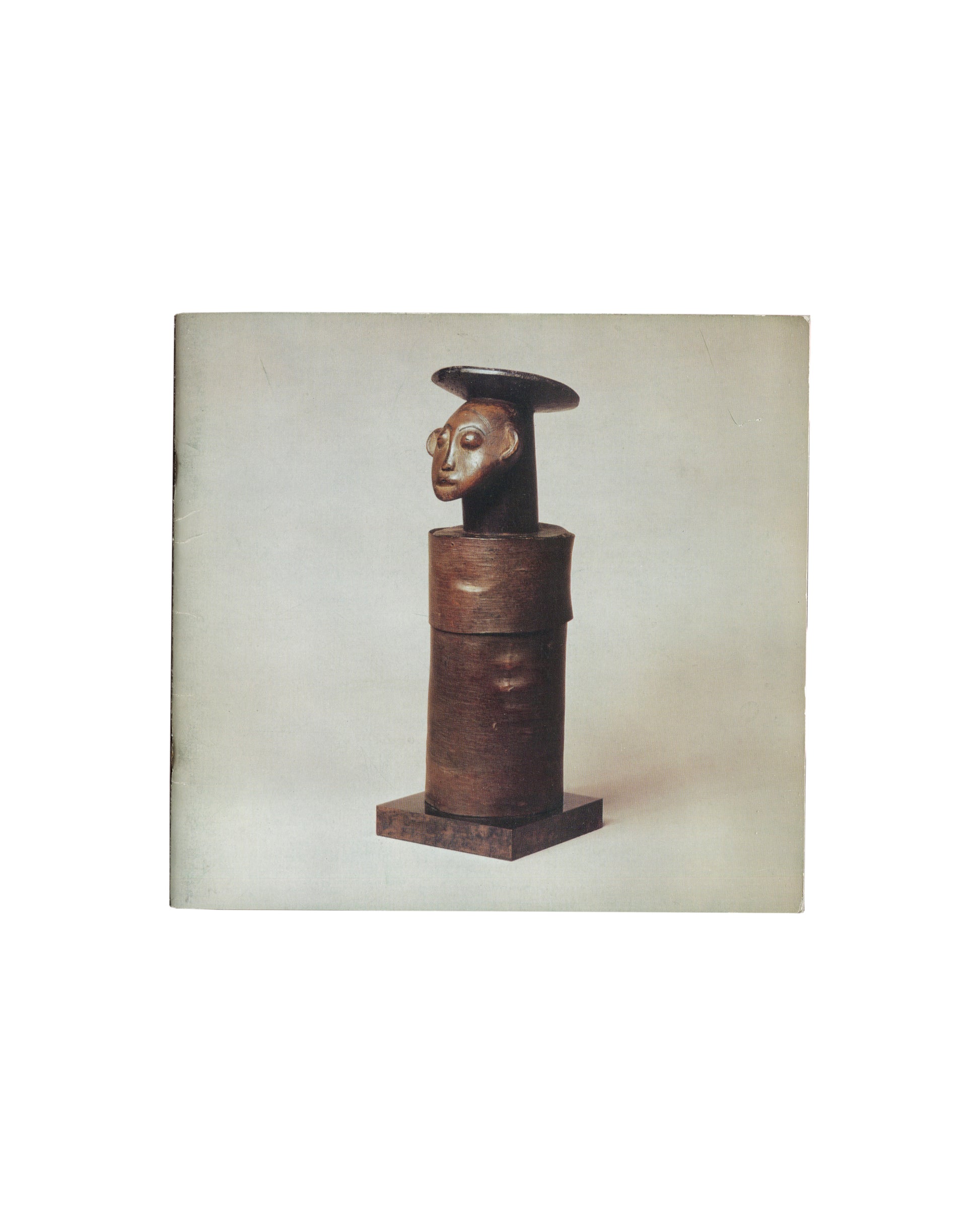 Gordon House, African Tribal Sculpture, The Arcade Gallery, London, 1976, front cover with carved figure on pale grey ground