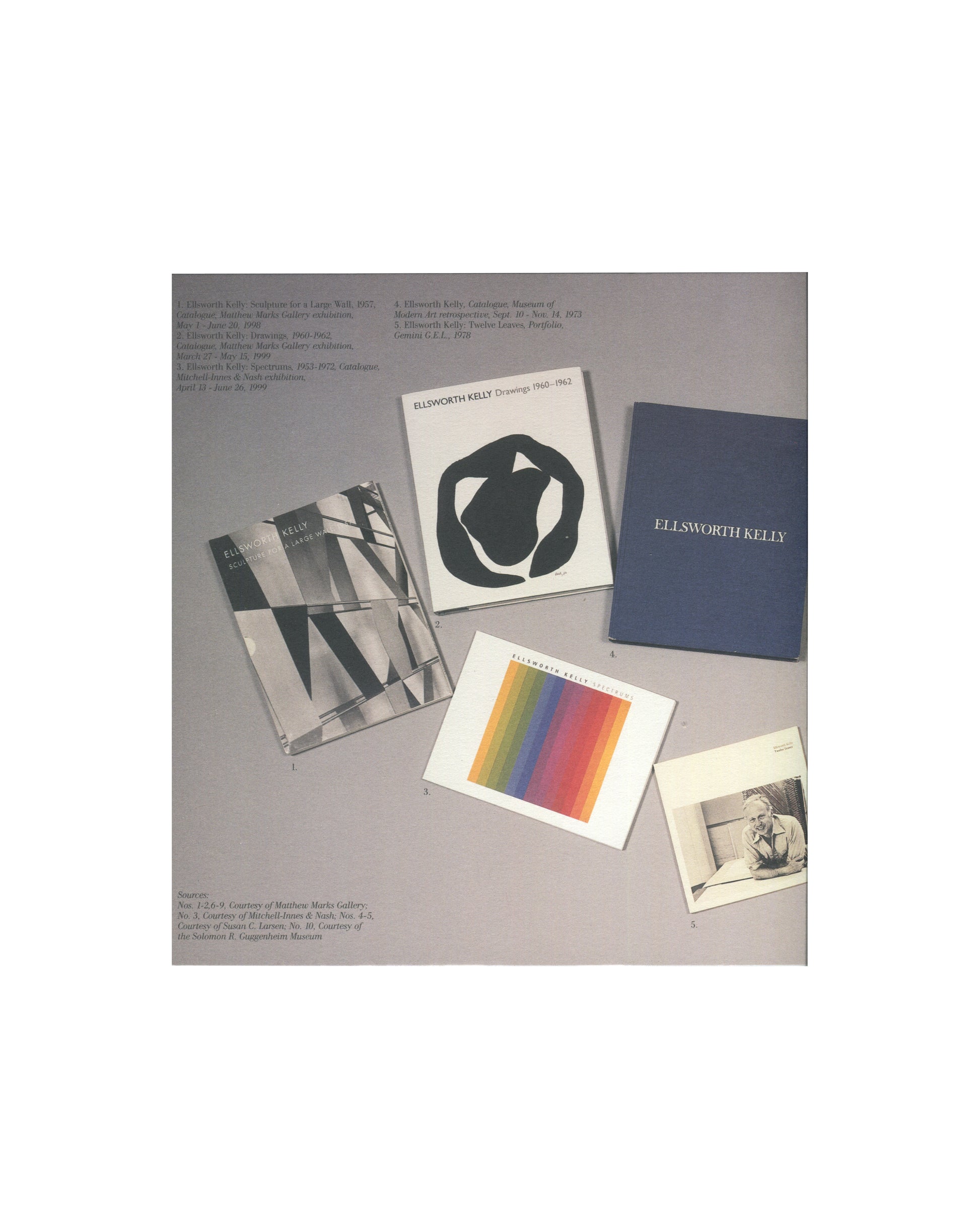 Ellsworth Kelly — A Salute to Ellsworth Kelly, 1999 — interior spread. Colour plate showing five Ellsworth Kelly publications arranged on a grey ground: Sculpture and Paintings (Blum Helman), Drawings 1960–1962 (Gemini G.E.L.), a blue cloth-bound monograph, a colour spectrum lithograph card, and a portrait photograph. Sources listed as Matthew Marks Gallery, Brooke Alexander, Susan C. Larsen, and Solomon R. Guggenheim Museum.