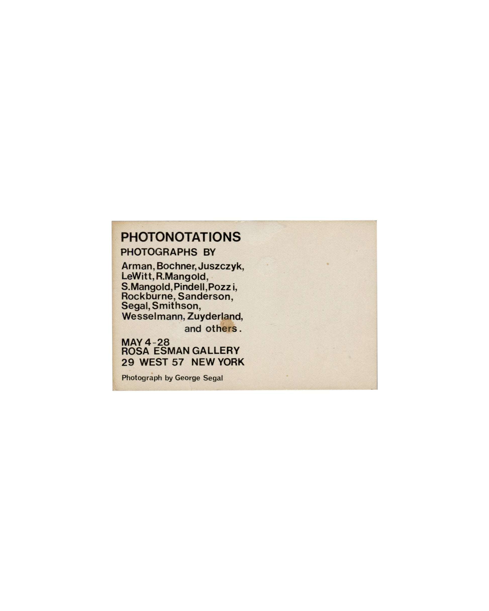 Verso — artist roster Photonotations, Rosa Esman Gallery, New York, 1976. Exhibition invitation verso: cream-white card; "PHOTONOTATIONS" in large bold black sans-serif type upper left; "PHOTOGRAPHS BY" in smaller bold black sans-serif type below; artist roster in regular black sans-serif type — "Arman, Bochner, Juszczyk, / LeWitt, R.Mangold, / S.Mangold, Pindell, Pozzi, / Rockburne, Sanderson, / Segal, Smithson, / Wesselmann, Zuyderland, / and others."; "MAY 4–28" in bold below; "ROSA ESMAN GALLERY / 29 WE