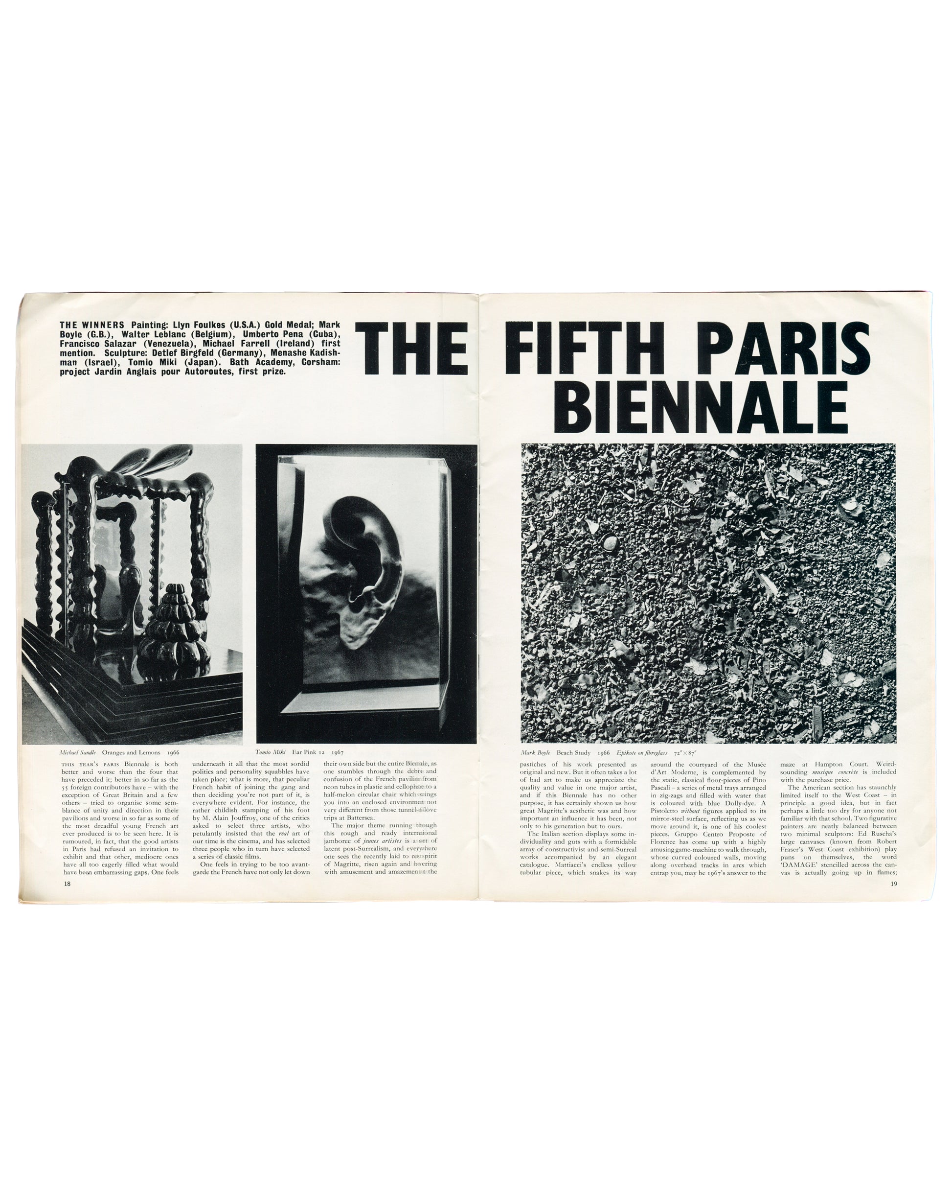 Interior spread of Art and Artists, Vol. II, No. 8, November 1967, pp. 18–19. Feature 'The Fifth Paris Biennale'. Left page: three black-and-white photographs of exhibited sculptures including Michael Sandle, Oranges and Lemons, 1966, and James Alter, Fair Paris II, 1967. Right page: large bold headline 'THE FIFTH PARIS BIENNALE' with black-and-white photograph of Mark Boyle, Beach Study, 1966, and dense two-column critical text listing prize winners.