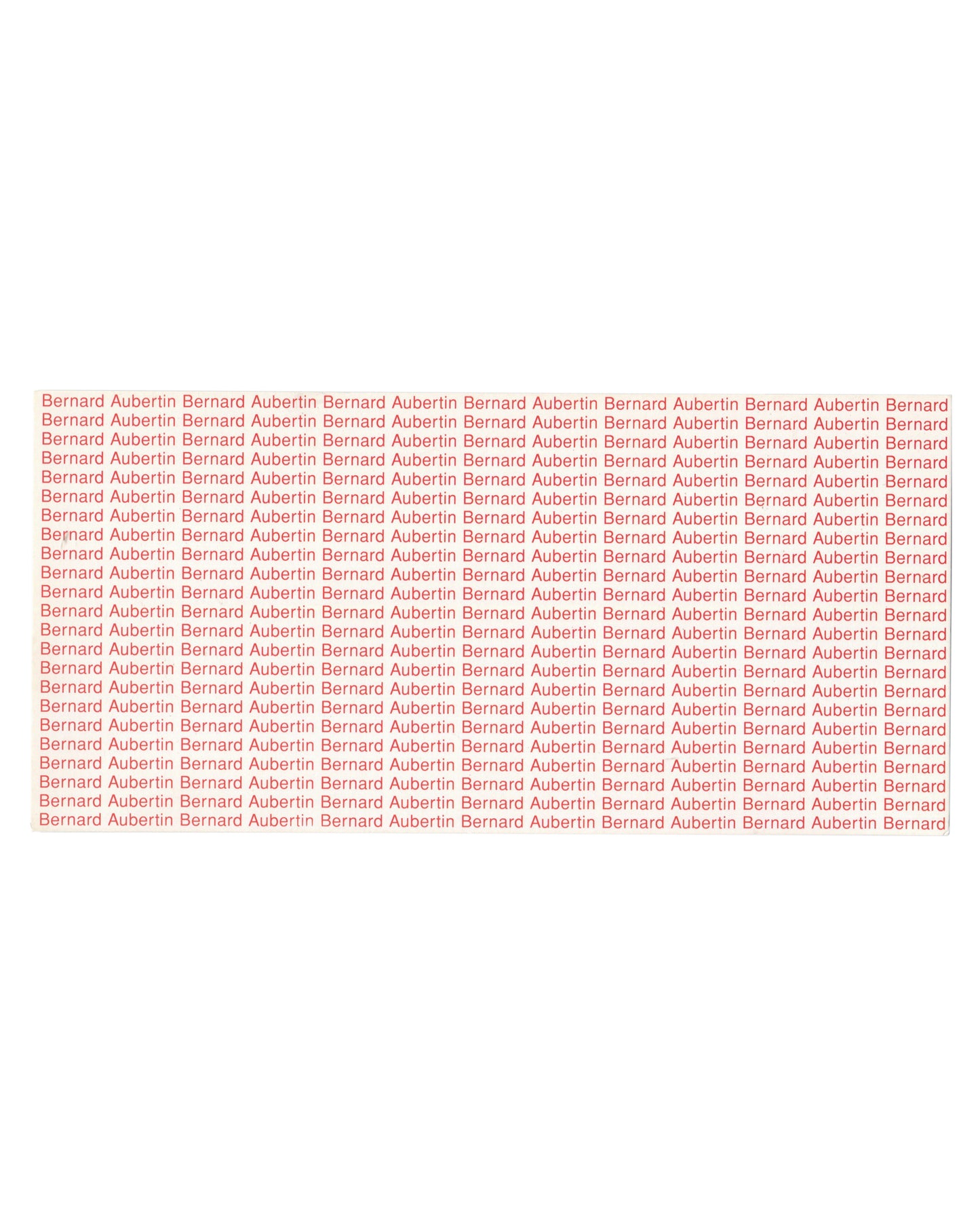Reverse of 1994 Bernard Aubertin Le feu de la couleur exhibition invitation card, Espace de l'Art Concret, Mouans-Sartoux — verso printed entirely in red on cream stock with the name Bernard Aubertin repeated in dense rows across the full surface of the card, functioning as typographic monochrome; name becomes pattern, artist becomes surface.