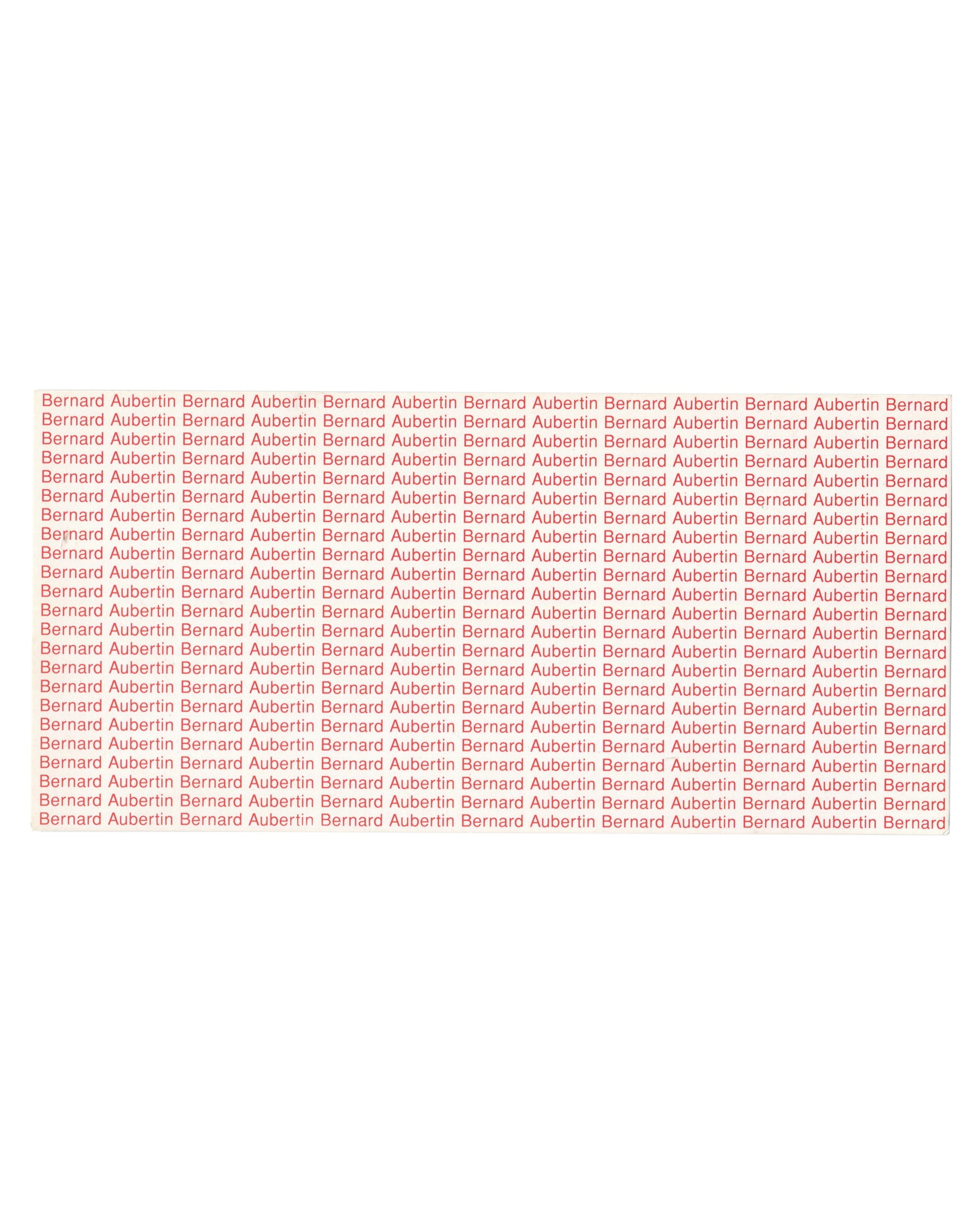 Reverse of 1994 Bernard Aubertin Le feu de la couleur exhibition invitation card, Espace de l'Art Concret, Mouans-Sartoux — verso printed entirely in red on cream stock with the name Bernard Aubertin repeated in dense rows across the full surface of the card, functioning as typographic monochrome; name becomes pattern, artist becomes surface.