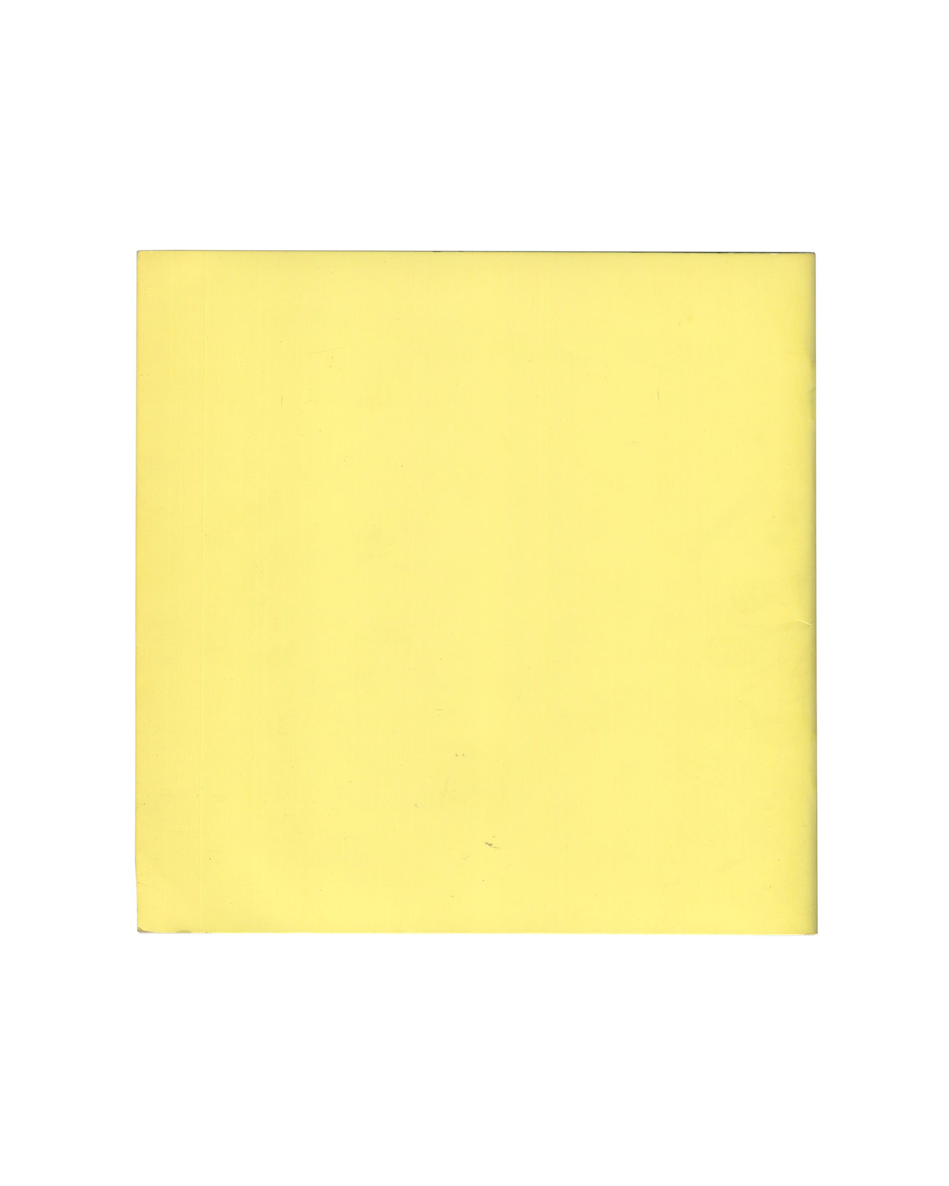 Reverse of 1970 Larry Bell, Robert Irwin, Doug Wheeler Tate Gallery catalogue. Plain pale yellow back cover showing faint ghost impression of handwritten or drawn text visible through the paper, with minor handling marks and age toning.