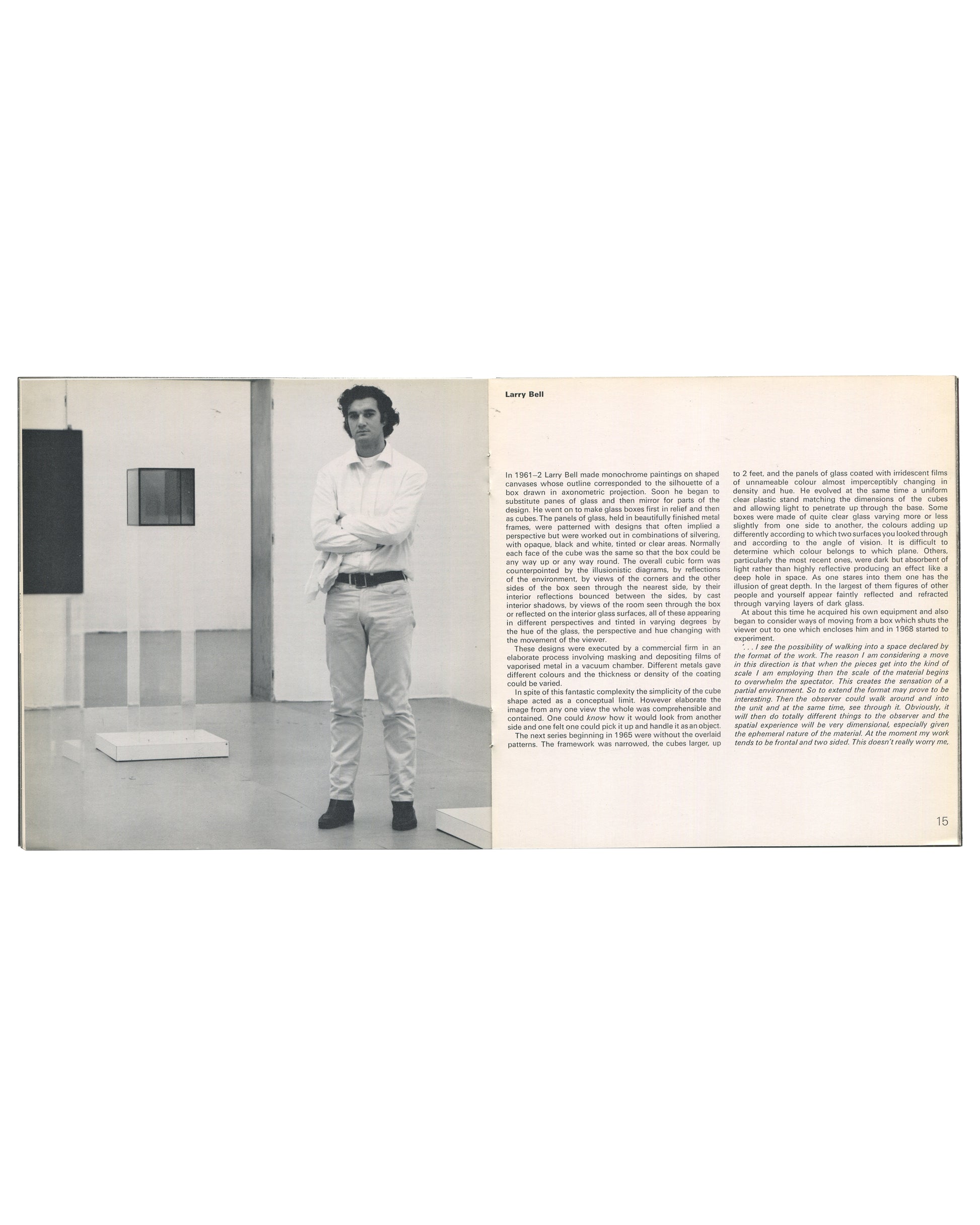 Interior spread from 1970 Larry Bell, Robert Irwin, Doug Wheeler, Tate Gallery. Page 15 showing a black-and-white photograph of Larry Bell standing in a gallery space beside a glass cube work, with extended interview text in two columns.