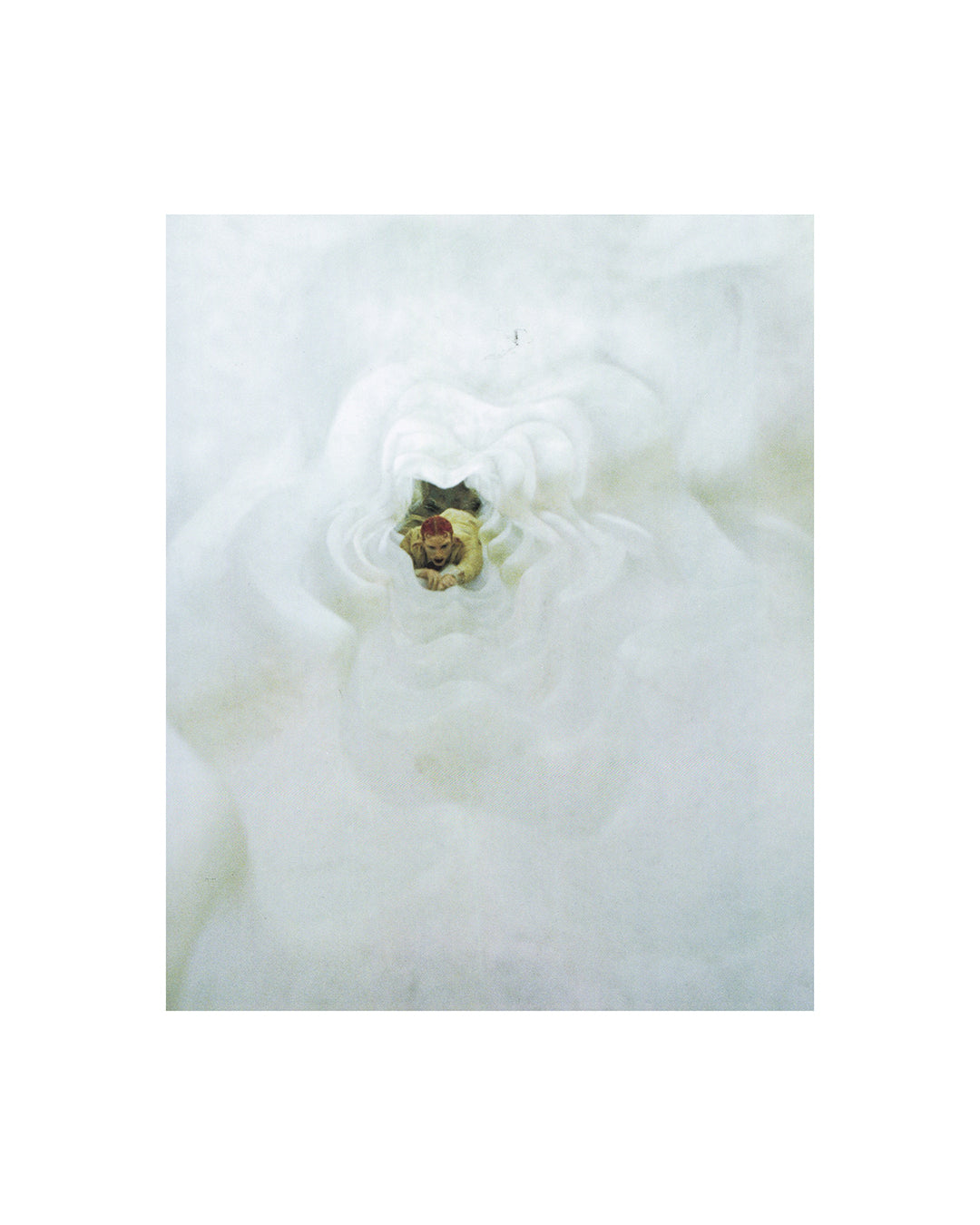Interior page from 2007 Matthew Barney Supercontemporary, Electa. Showing a production photograph of Barney's figure emerging through a dense mass of white fibrous material, face barely visible at centre.