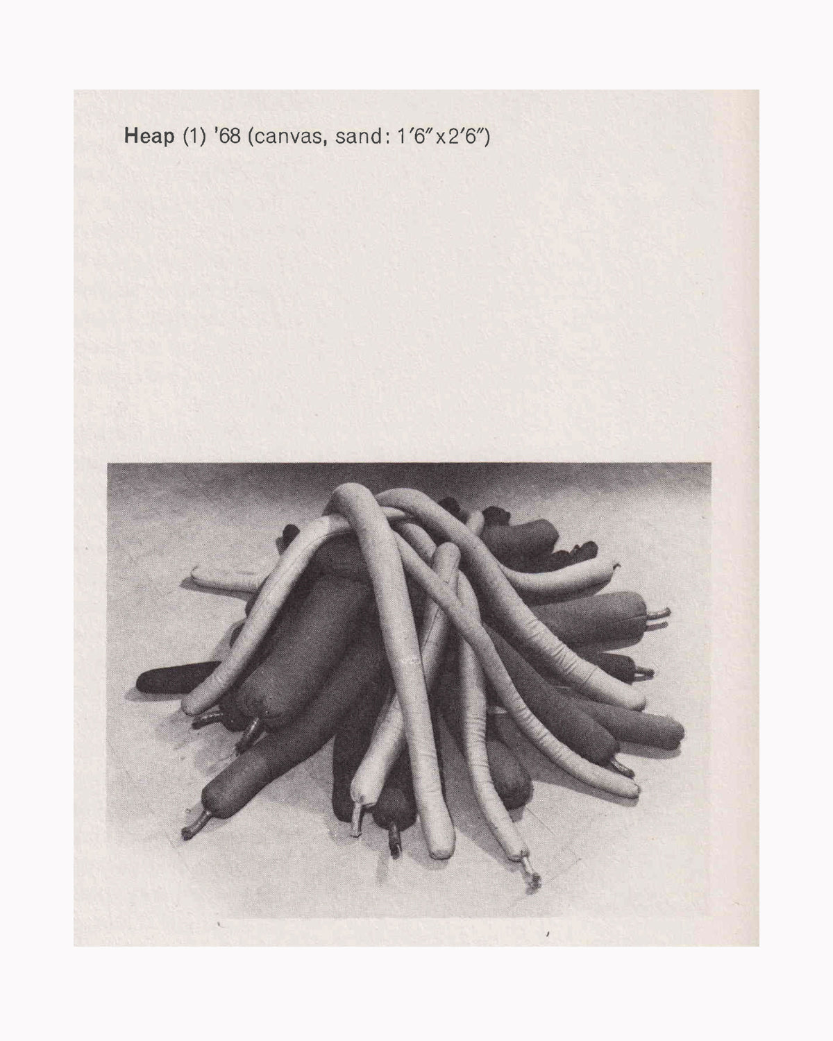 Barry Flanagan, Heap (1), 1968 — canvas and sand, 1'6" x 2'6" — black and white catalogue photograph showing a mounded pile of sand-filled canvas tubes heaped on the floor — reproduced in Sculptures 1966–1976, Van Abbemuseum, 1977