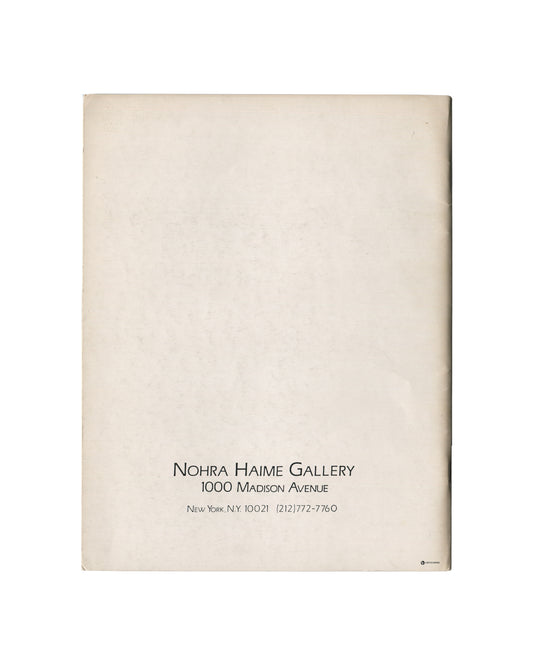 Reverse of c.1985 Constructures: New Perimetrics in Abstract Painting exhibition catalogue showing plain cream-white matte stock with warm age toning and light surface marks, with small centred black serif and small-cap typography at lower centre reading 'NOHRA HAIME GALLERY / 1000 Madison Avenue / New York, N.Y. 10021 (212)772-7760'.