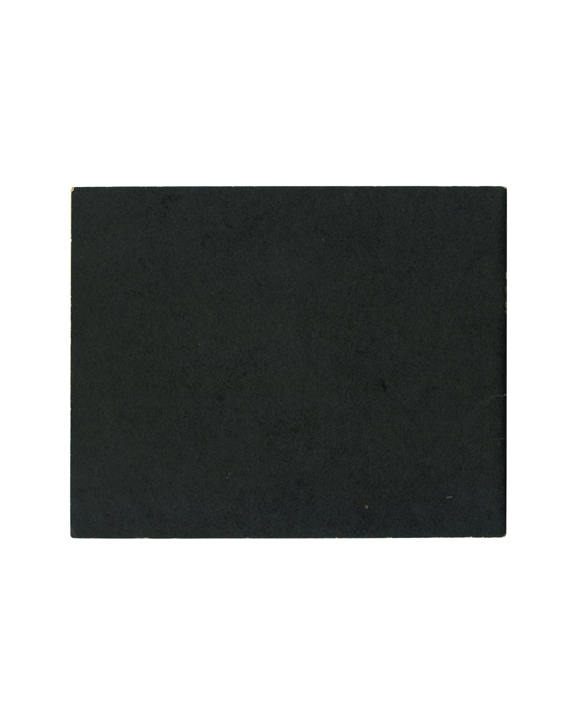 Plain black card with pronounced rubbing, scratching and edge wear. Saddle-stapled spine visible at left.