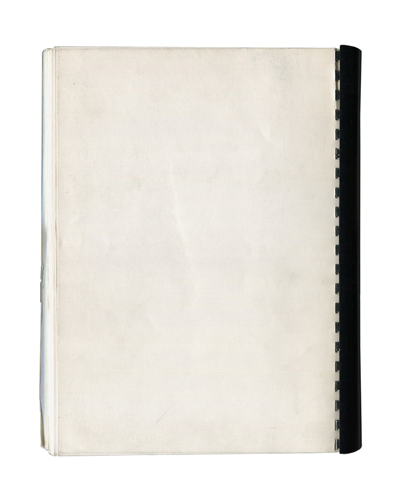 Reverse of 1989 Coup d'envois ou l'art à la lettre Musée de La Poste press dossier showing plain cream-white stock with black spiral binding at right edge, light age toning, surface marks, and soft creasing consistent with archive storage and institutional circulation.