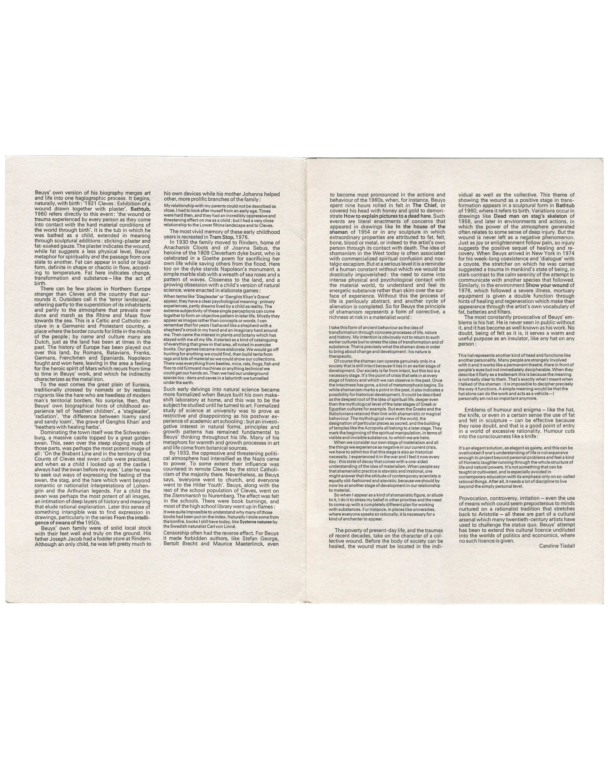 Full opening showing Caroline Tisdall's essay in three columns across both pages — biography, Cleves, wartime mythology, shamanism, fat, felt, wounds. No illustrations.
