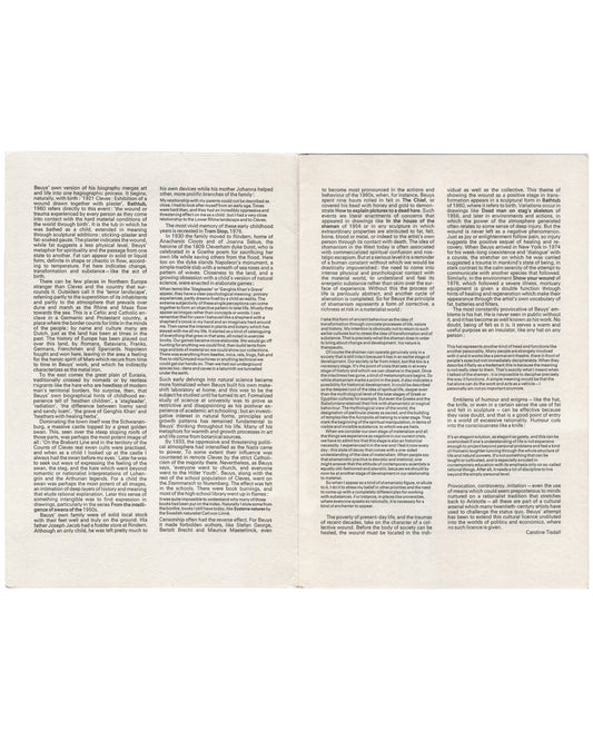Full opening showing Caroline Tisdall's essay in three columns across both pages — biography, Cleves, wartime mythology, shamanism, fat, felt, wounds. No illustrations.
