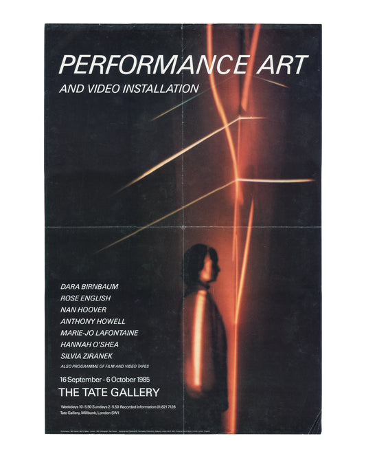 Original 1985 exhibition poster, Performance Art and Video Installation, The Tate Gallery, Millbank, London, 16 September – 6 October 1985. Offset lithograph on paper, approx. 52 × 76 cm. Published by Tate Gallery Publications; printed by Gavin Martin Ltd, London. Black ground. Upper half: large white italic bold title 'PERFORMANCE ART' with smaller caps subtitle 'AND VIDEO INSTALLATION' below; three diagonal amber-gold light trails crossing from lower left to upper right against deep red-brown ground. Lowe