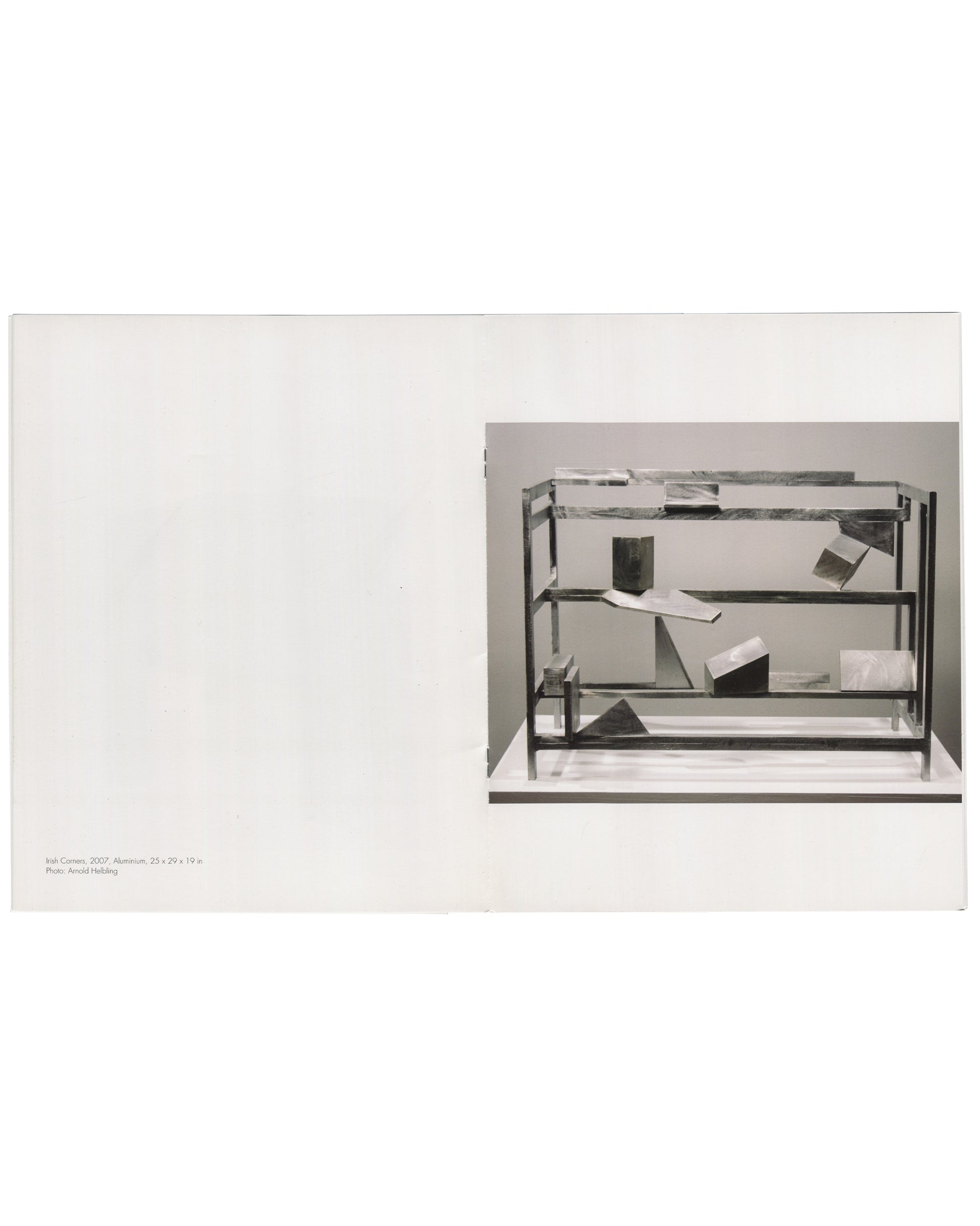 Willard Boepple, New Sculpture, Broadbent Gallery, London, 2008. Interior spread: left, white page blank; right, black-and-white photograph of Irish Corners (2007), aluminium, 25 × 29 × 19 in — open shelf framework with angled plates, irregular blocks and geometric forms suspended at varying heights. Caption lower left, photo credit Arnold Helbling.