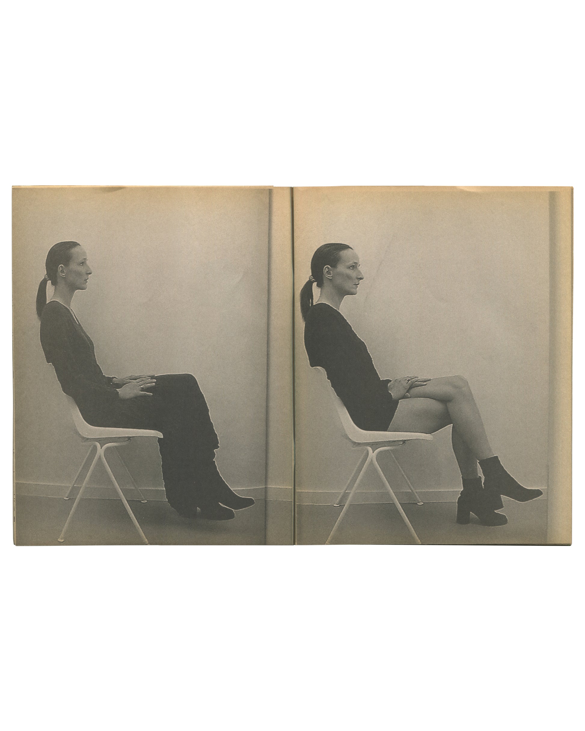 nterior spread of c. 2002 Mark Borthwick Xerox edition of 2000-1, Maison Martin Margiela. Double-page spread showing two near-identical grayscale Xerox photographs of a woman seated in profile on a white folding chair against a plain pale ground: left image showing her in full-length dark trousers and ankle boots, right image showing the same pose with a shorter skirt and ankle boots, hands resting on knees, hair in a low ponytail. The diptych presents the same body and posture with a single change of garme