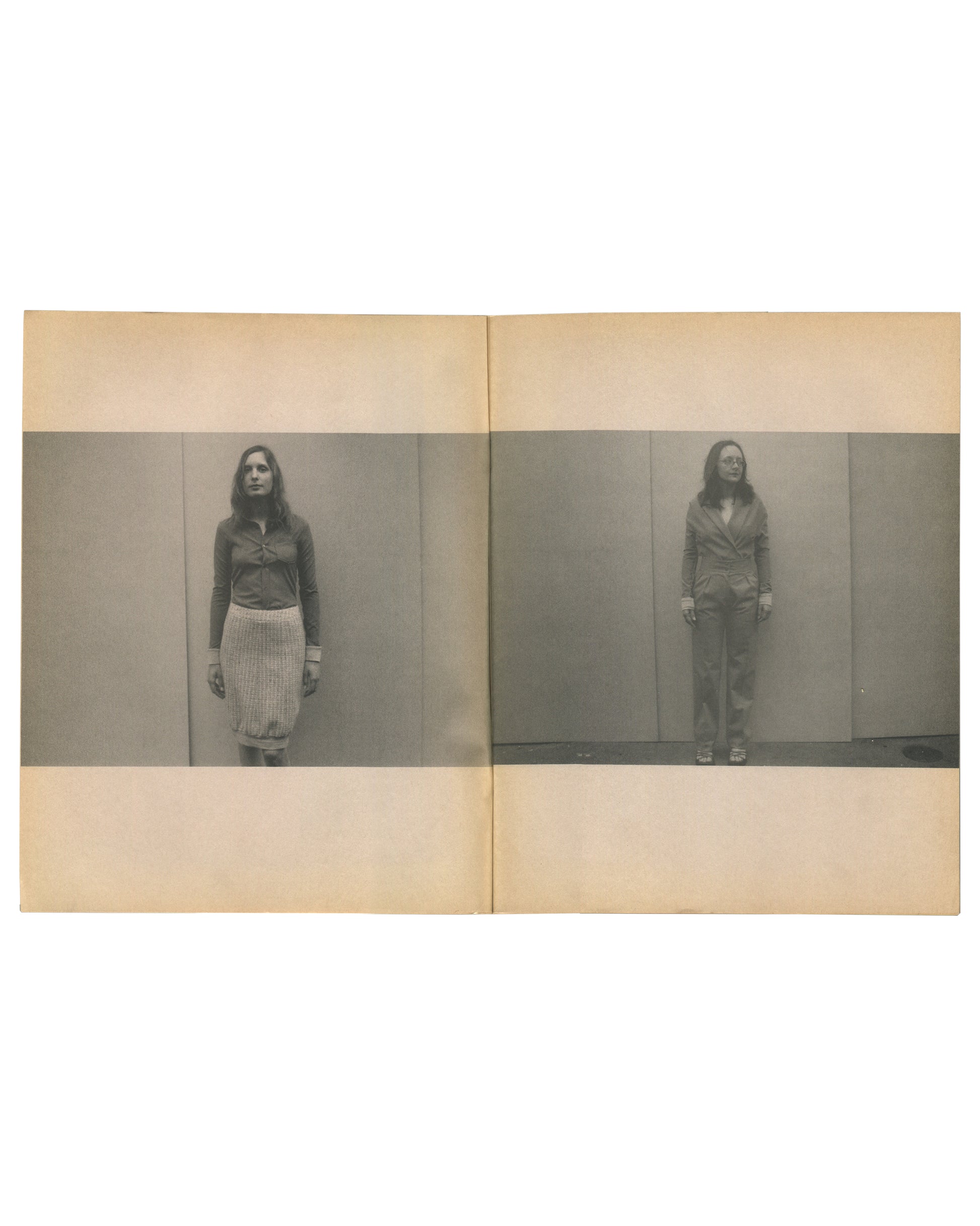 nterior spread of c. 2002 Mark Borthwick Social Documentaries Amid this Piste, self-published photocopy edition. Double-page spread showing two grayscale Xerox photographs of a woman standing facing the camera against a plain studio wall: left image showing her in a dark zip-up top and a pale pleated midi skirt with white cuffs or wristbands; right image showing the same woman in a dark belted jacket and trousers with white cuffs, standing slightly further from the wall. Both images printed as horizontal ba