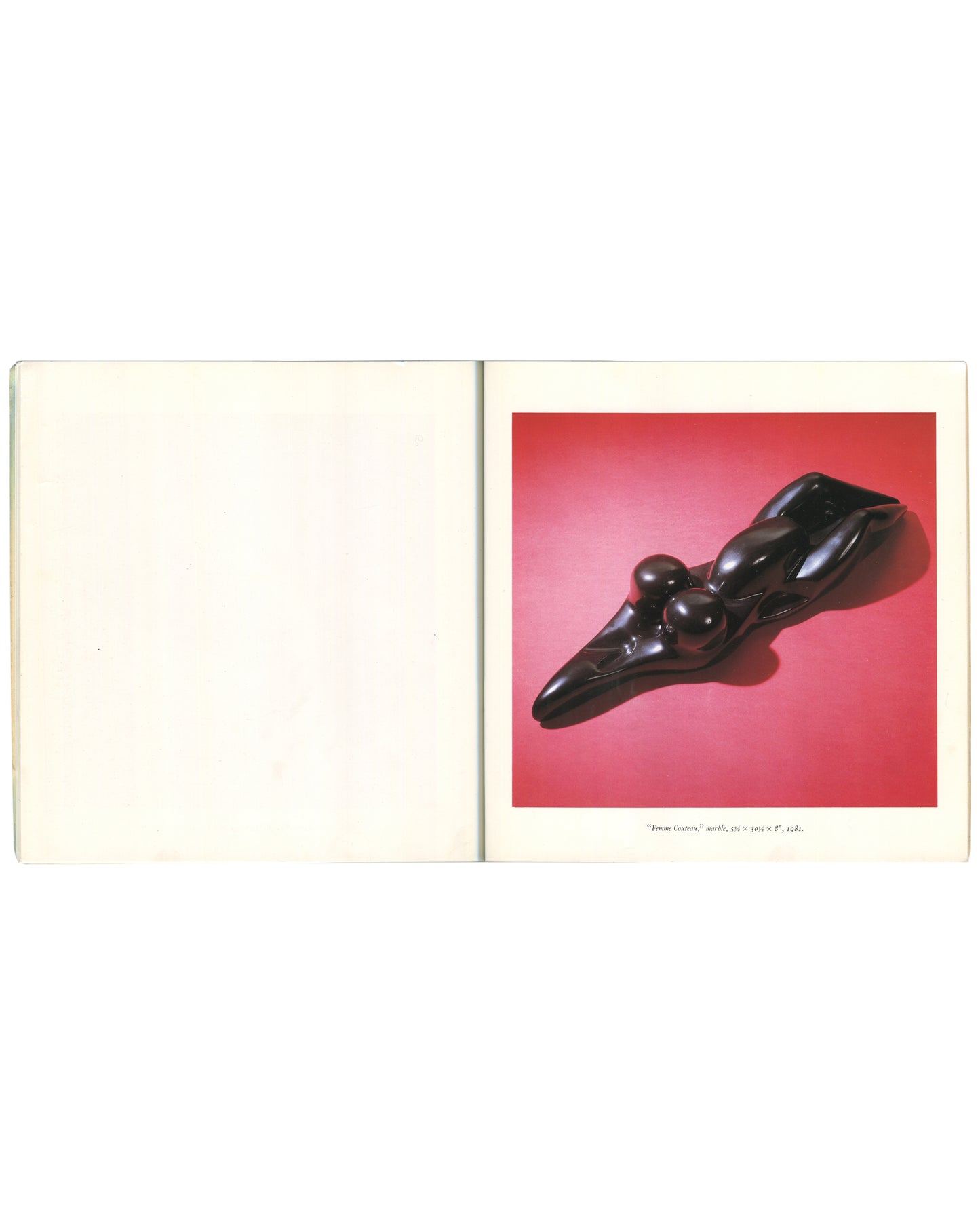 Interior spread of 1982 Louise Bourgeois Bourgeois Truth — left page blank; right page with colour plate of a dark polished marble sculpture 'Femme Couteau', 1969, a reclining biomorphic form with rounded protrusions on a red ground