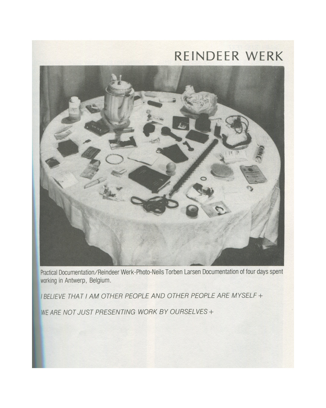nterior page from 1979 Performance by Artists, Art Metropole. Reindeer Werk section showing a black-and-white photograph of a round table covered with personal objects, tools, and documents, captioned as practical documentation from four days in Antwerp, Belgium, photo by Neils Torben Larsen.