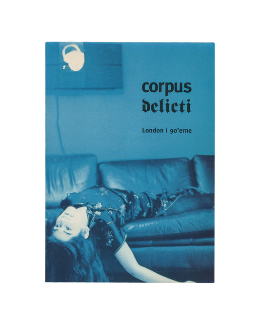 Corpus Delicti: London i 90'erne, Kunstforeningen, Copenhagen, 1995, front cover, blue photograph of woman lying inverted on leather sofa