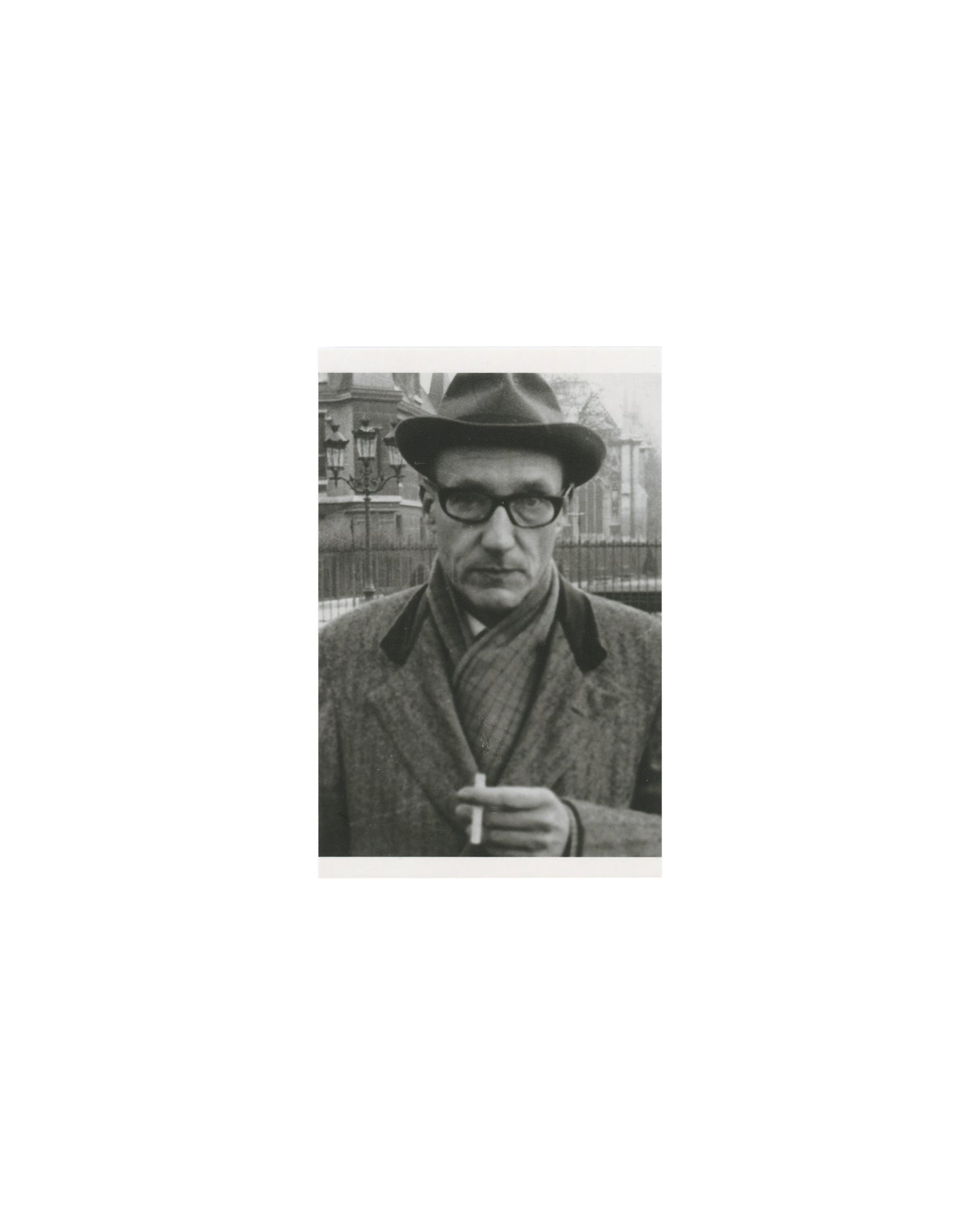 William S. Burroughs, black-and-white press portrait, hat and coat, cigarette, Penguin Modern Classics postcard 