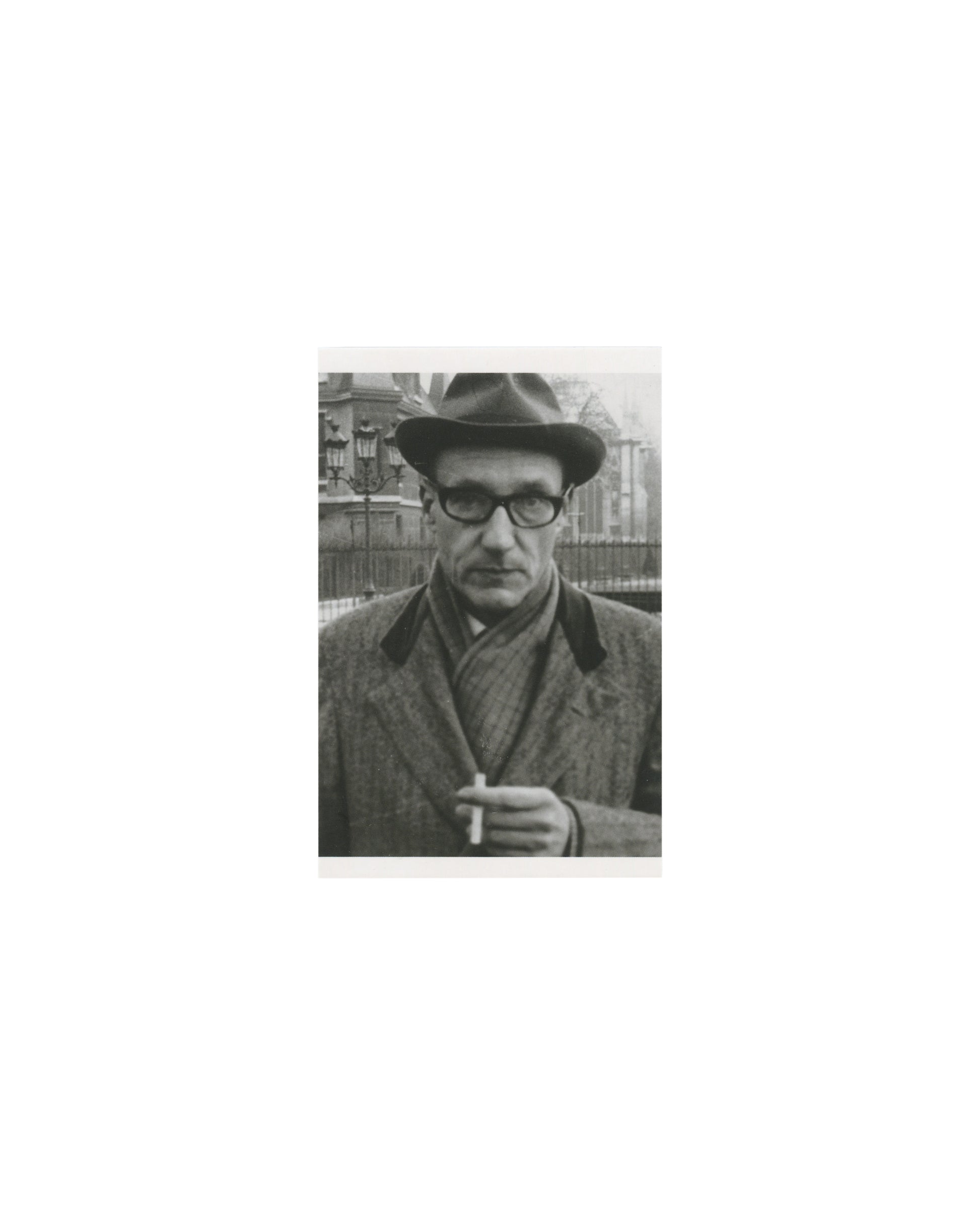 William S. Burroughs, black-and-white press portrait, hat and coat, cigarette, Penguin Modern Classics postcard 