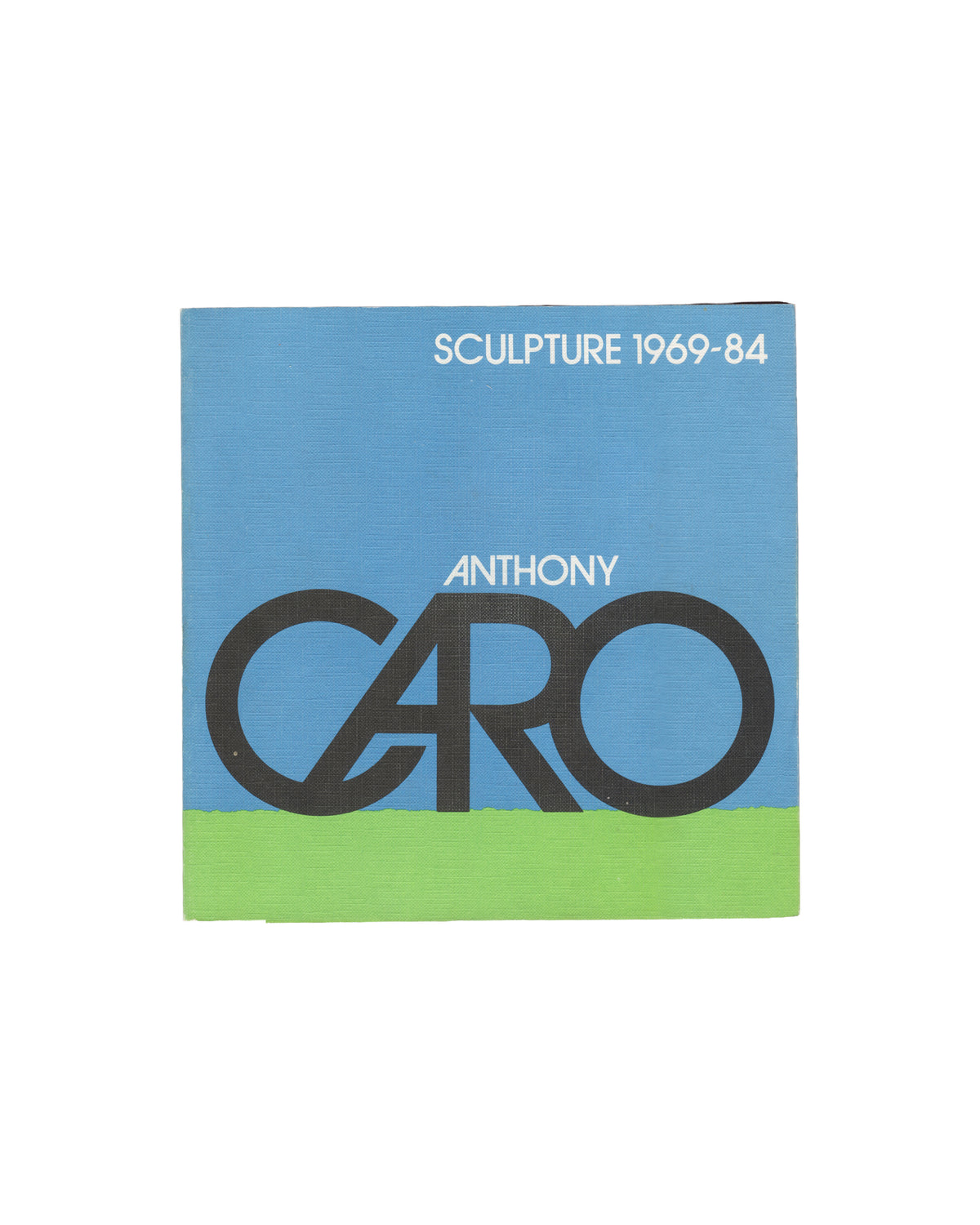 Anthony Caro, Sculpture 1969–84, Arts Council, 1984, front cover, CARO in black letters on green ground under blue sky