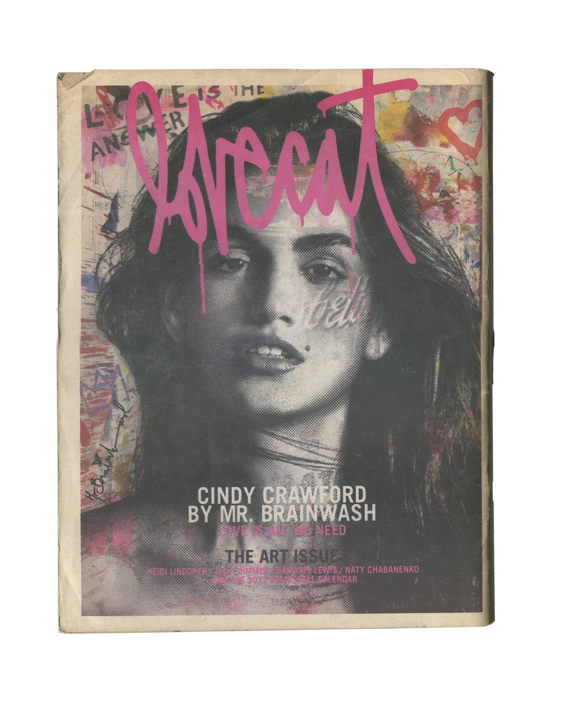 Original 2012 Lovecat: The Model Fanzine, Issue 3, The Art Issue, New York. Cover showing a large black-and-white halftone portrait of Cindy Crawford overlaid with pink graffiti-style 'lovecat' lettering, pink heart, and handwritten text reading 'Love is the Answer'. Caption reads 'CINDY CRAWFORD BY MR. BRAINWASH / THE ART ISSUE'. General handling wear and edge wear consistent with period fanzine.