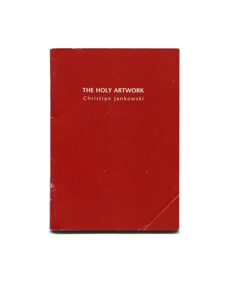 Red book titled 'The Holy Artwork' by Christian Jankowski on a white background