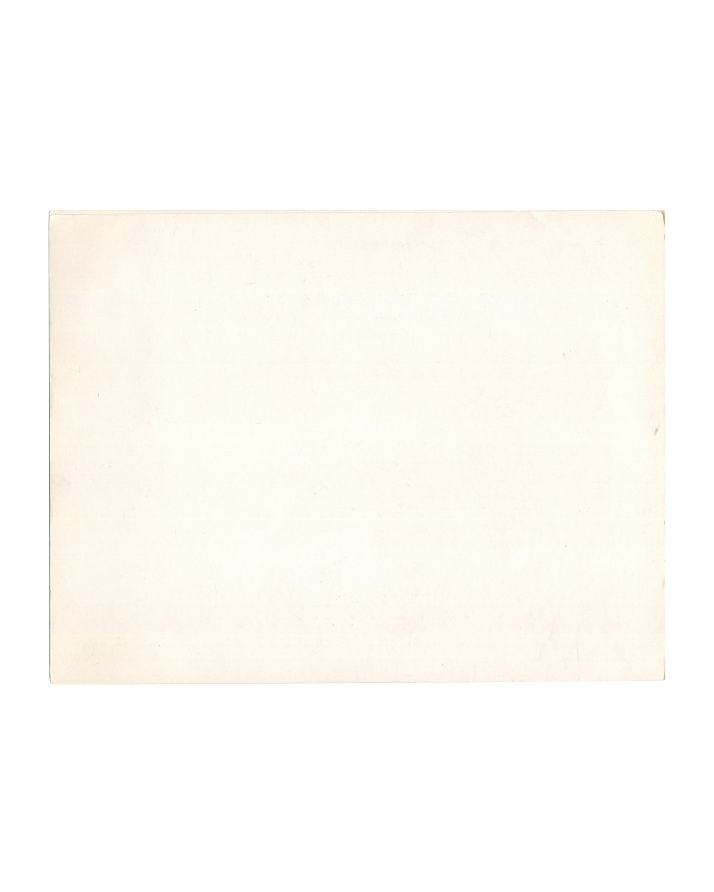 Reverse of 1977 Dalí La Gare de Perpignan Galerie André François Petit invitation card. Plain cream card stock with warm age toning, light surface marks, and soft edge wear.