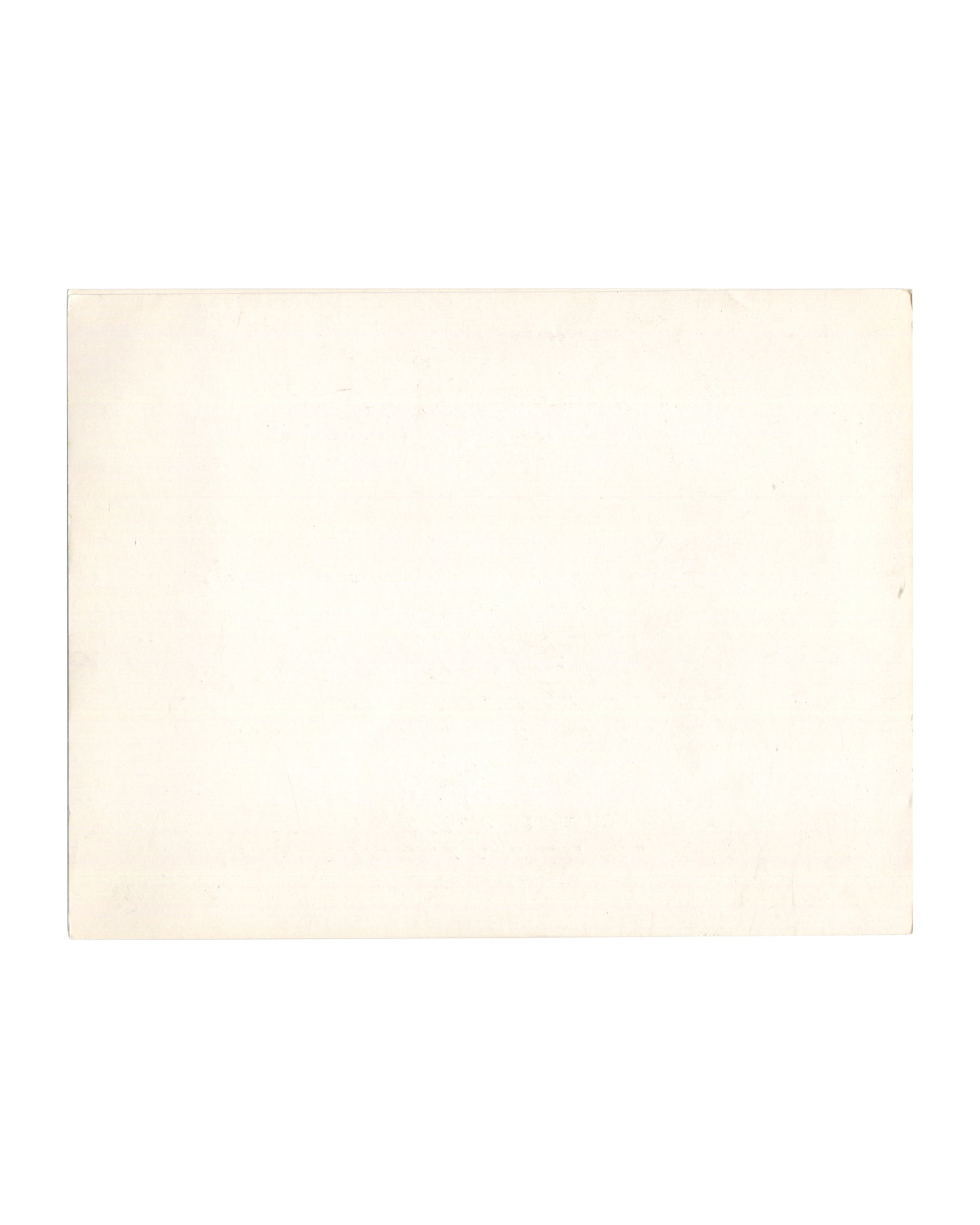 Reverse of 1977 Dalí La Gare de Perpignan Galerie André François Petit invitation card. Plain cream card stock with warm age toning, light surface marks, and soft edge wear.