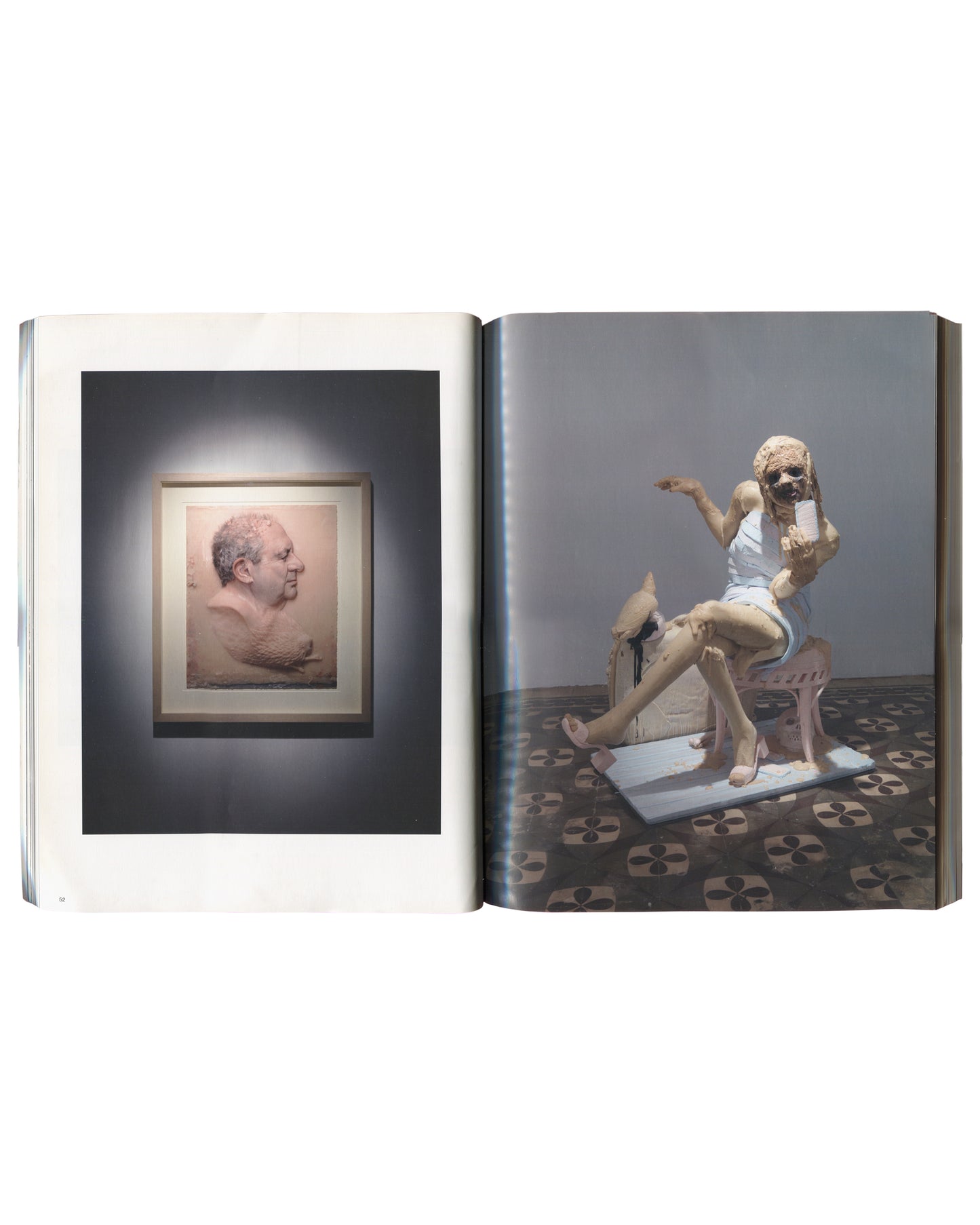 framed relief in gallery with directional lighting. Right: seated female figurative sculpture with cracked painted surface on patterned tile floor.