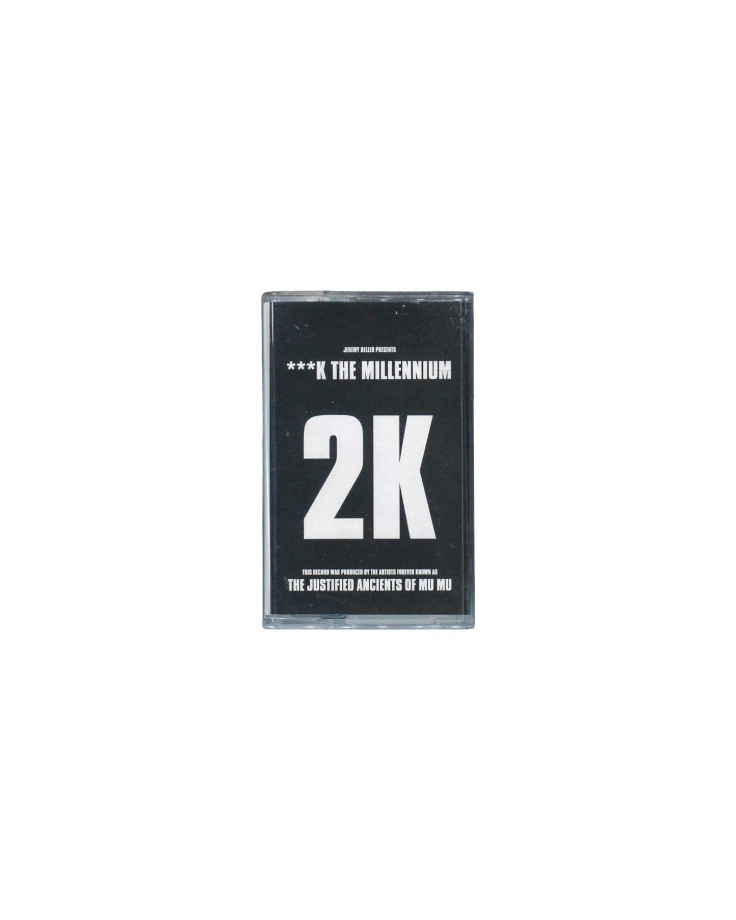 Jeremy Deller presents 2K — ***K The Millennium, Blast First 1997, cassette in clear case, black J-card, Justified Ancients of Mu Mu