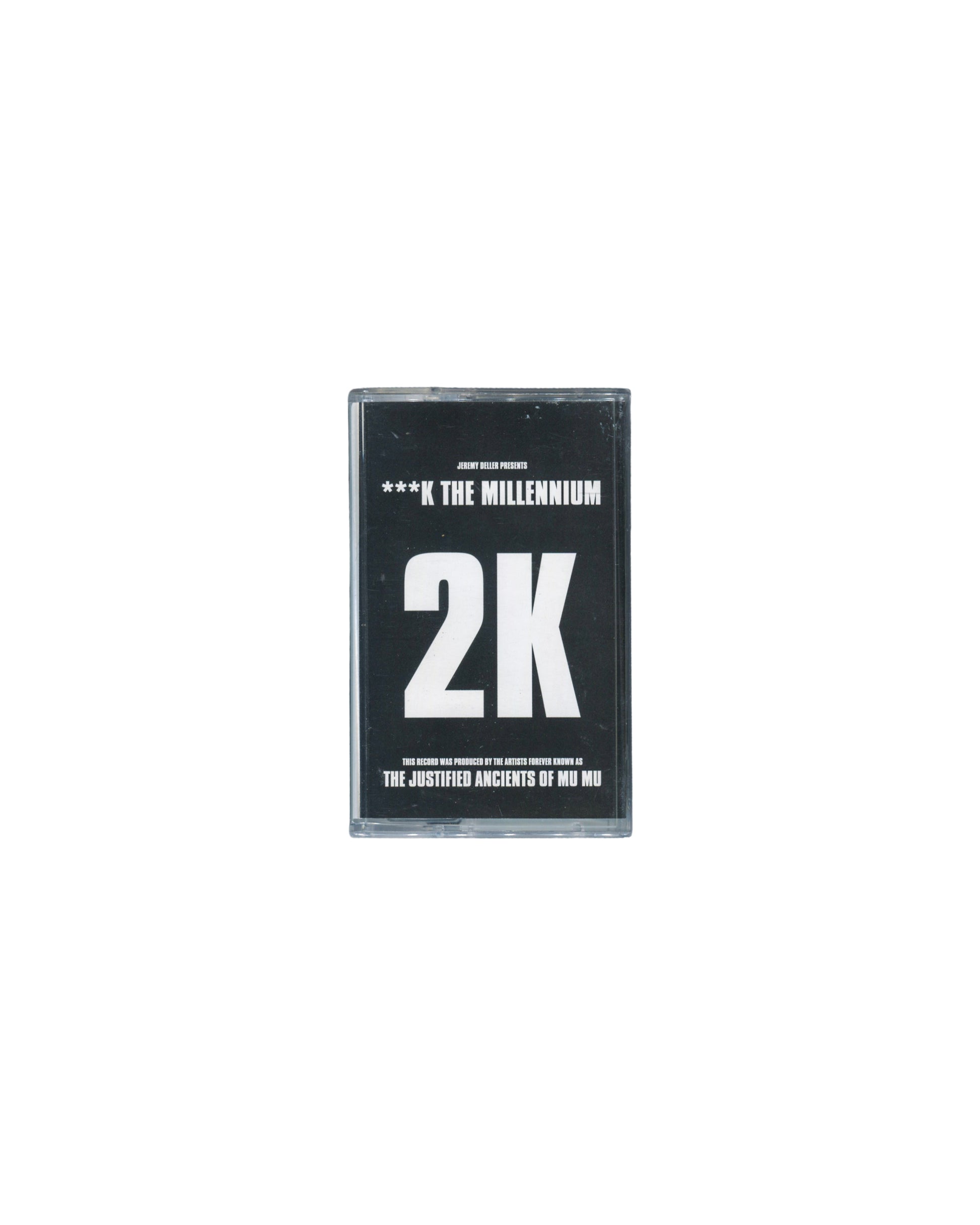Jeremy Deller presents 2K — ***K The Millennium, Blast First 1997, cassette in clear case, black J-card, Justified Ancients of Mu Mu