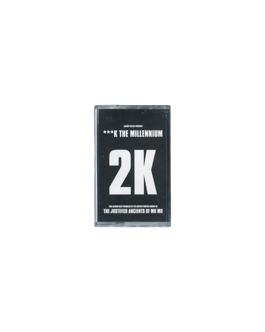 Jeremy Deller presents 2K — ***K The Millennium, Blast First 1997, cassette in clear case, black J-card, Justified Ancients of Mu Mu