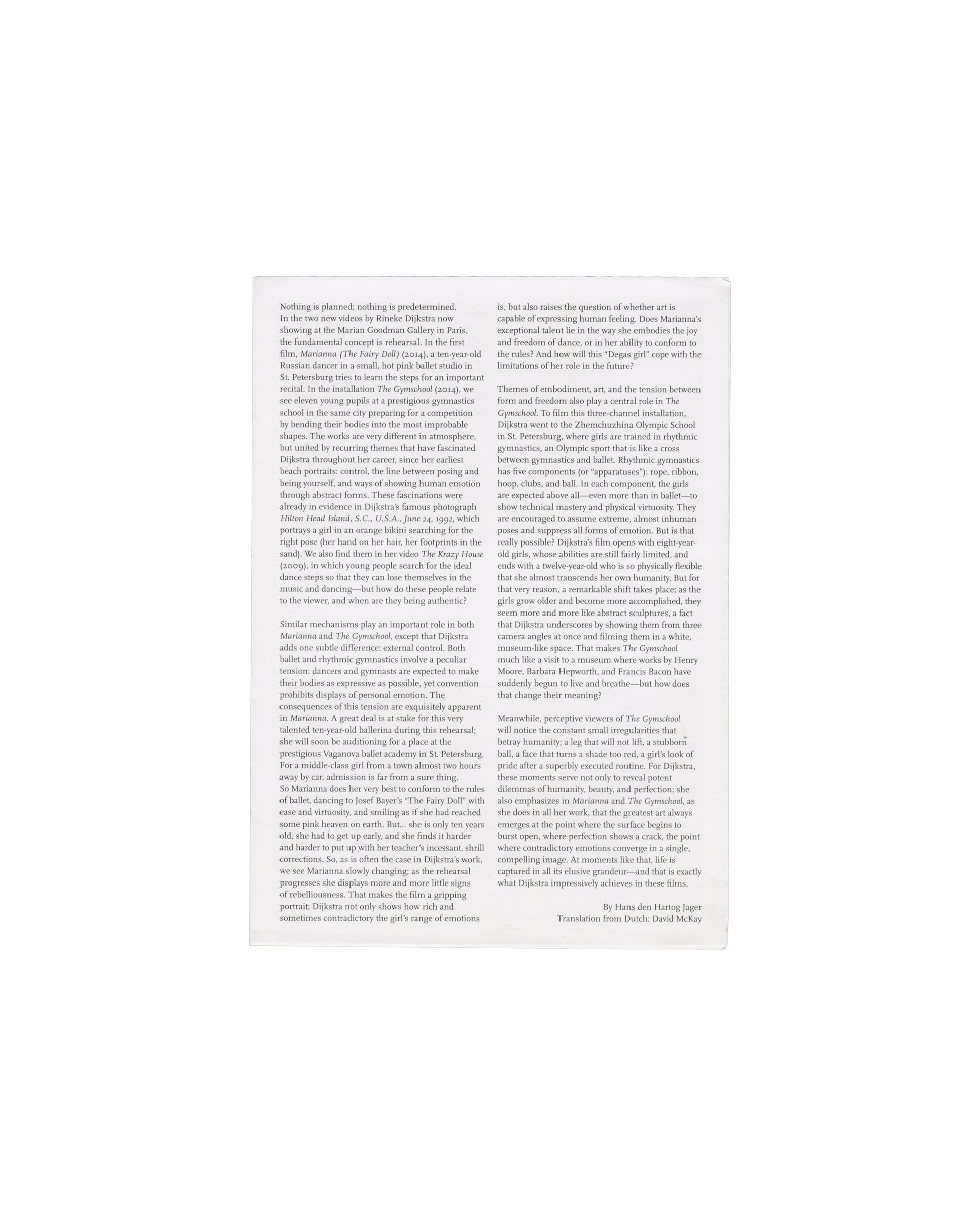 Handout back — critical text Rineke Dijkstra, The Gymschool, St Petersburg / Marianna (The Fairy Doll), Galerie Marian Goodman, Paris, 2015. Exhibition handout back panel: white paper with critical essay by Hans den Hartog Jager in two columns of small black serif type, translated by David McKay. Text discusses Dijkstra's video works in relation to embodiment, performance, freedom and control in ballet and rhythmic gymnastics training, with reference to Marianna's rehearsal at the Vaganova Academy and the Z