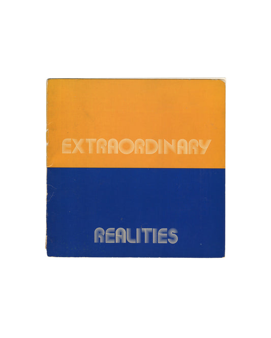 Original 1973 Robert Doty, Extraordinary Realities, Whitney Museum of American Art, New York. Square softcover divided horizontally into two equal bands — upper half in warm amber-orange, lower half in deep cobalt blue — with 'EXTRAORDINARY' in white outlined rounded sans-serif type on the orange field and 'REALITIES' in the same type on the blue field. Spine wear, edge rubbing, and corner creasing consistent with period."