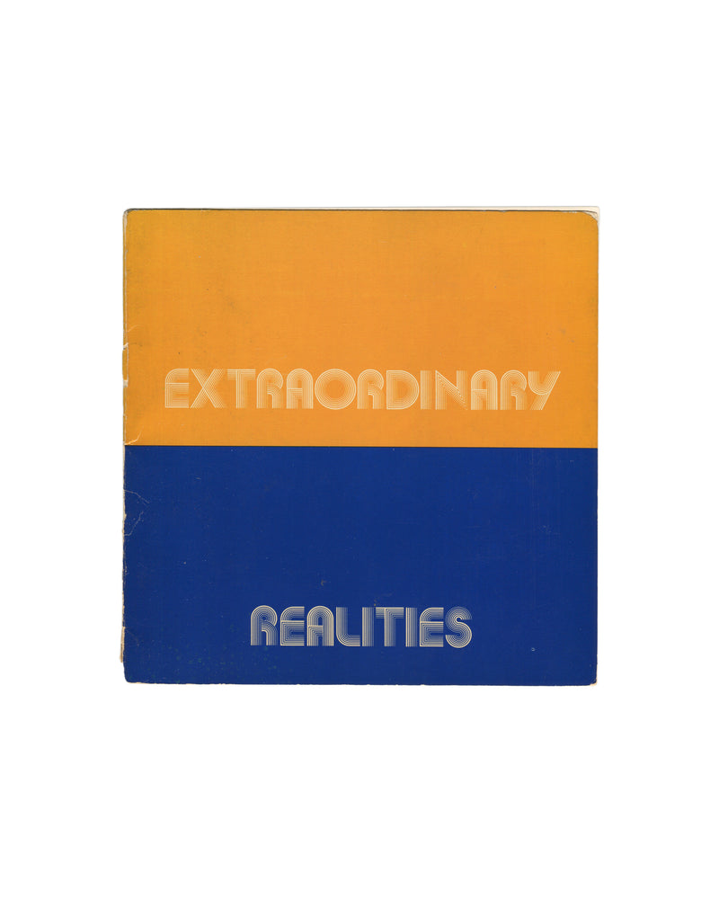 Original 1973 Robert Doty, Extraordinary Realities, Whitney Museum of American Art, New York. Square softcover divided horizontally into two equal bands — upper half in warm amber-orange, lower half in deep cobalt blue — with 'EXTRAORDINARY' in white outlined rounded sans-serif type on the orange field and 'REALITIES' in the same type on the blue field. Spine wear, edge rubbing, and corner creasing consistent with period."