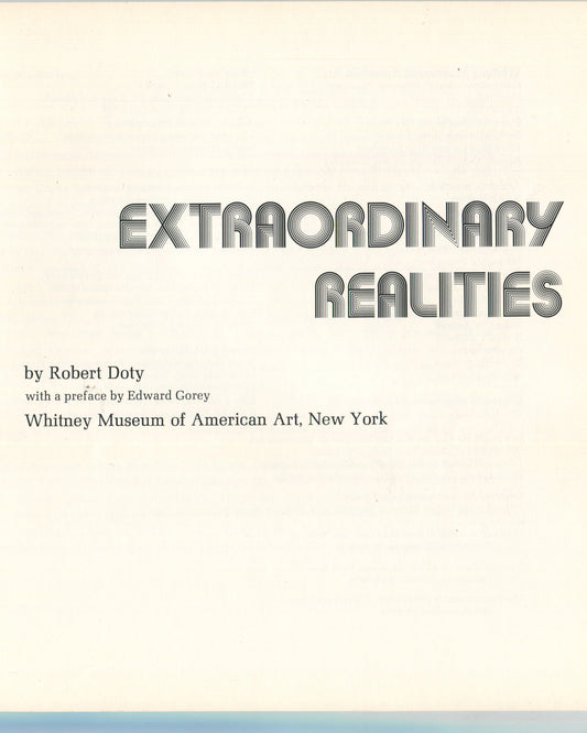 nterior title page from 1973 Robert Doty, Extraordinary Realities, Whitney Museum of American Art. Cream page with 'EXTRAORDINARY REALITIES' in large black outlined rounded sans-serif type at top, followed by 'by Robert Doty / with a preface by Edward Gorey / Whitney Museum of American Art, New York' in smaller serif type below.