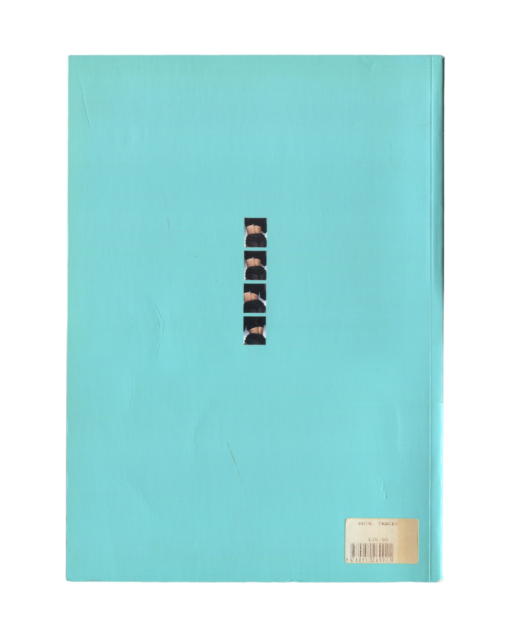 Tracey Emin — I Need Art Like I Need God, Jay Jopling/London, 1998. Back cover. Solid turquoise glossy ground. Centre: narrow vertical strip of five black-and-white photographic fragments of the artist's body, sequenced like a contact sheet. Original price/barcode sticker lower right: £25.00, Emin / Tracey. Exhibition monograph, South London Gallery 1997. 