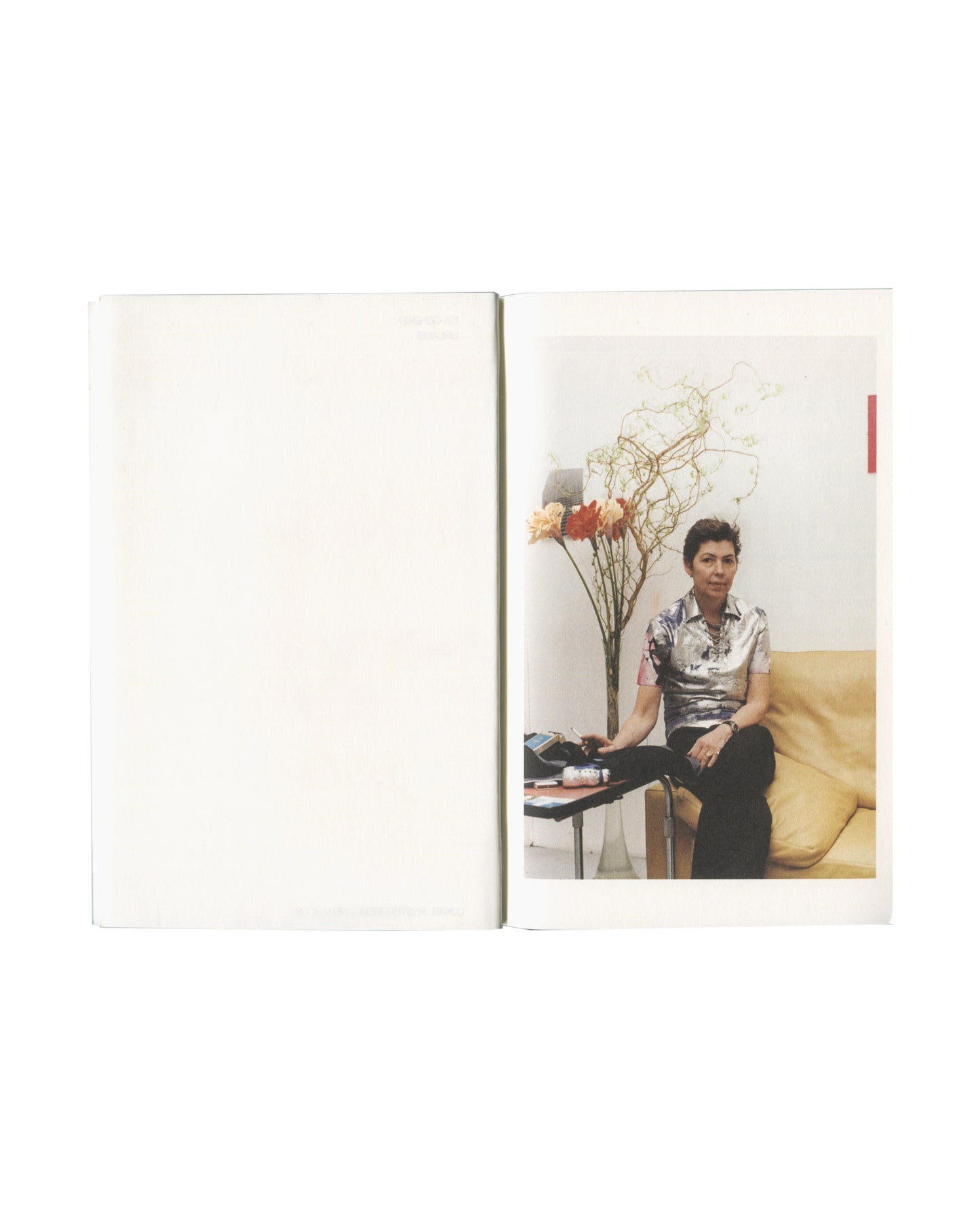 Isa Genzken, Urlaub, 2000 — interior spread with portrait photograph of a woman seated on a yellow sofa with flowers