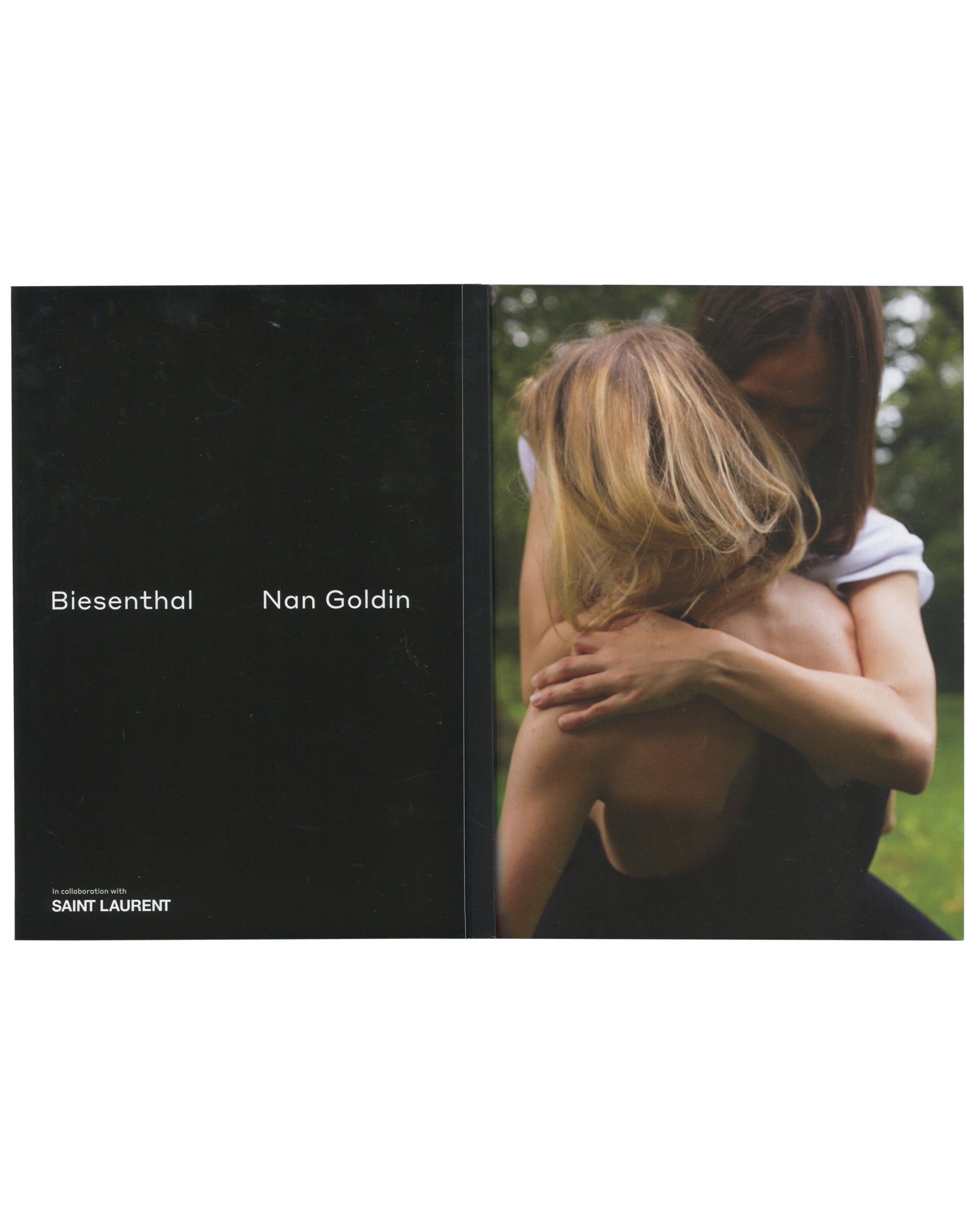Original 2017 Nan Goldin, Biesenthal, Document Journal in collaboration with Saint Laurent. Cover showing a colour photograph of a partially visible female figure at right — bare torso, sequined mini skirt, holding a cigarette — against a large dark wall with warm ambient light at upper left. No title text on cover; image bleeds to edges.